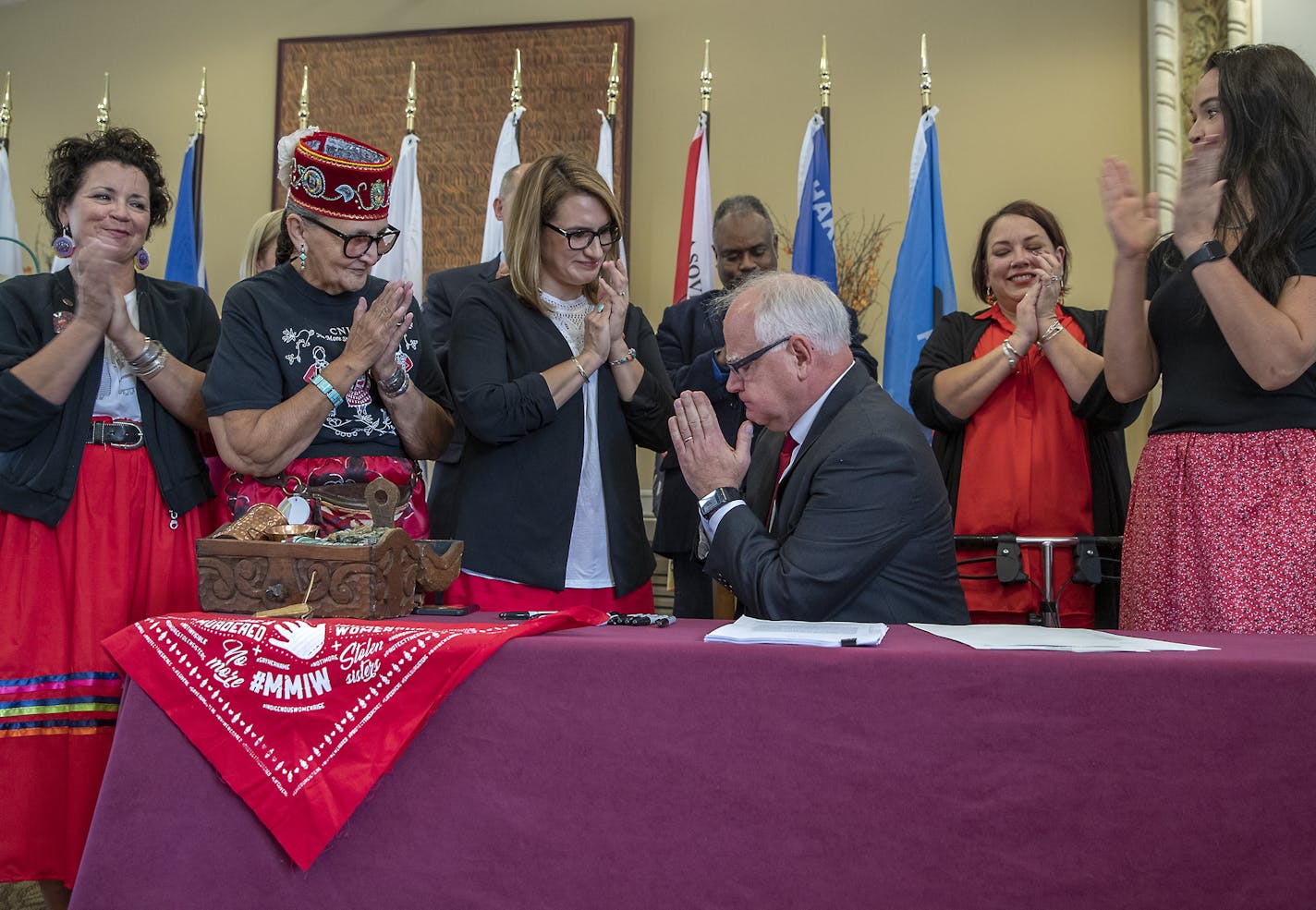 Governor Walz gestured a sign of respect to Ojibwe Elders and Lieutenant Governor Peggy Flanagan after he signed a bill to launch the first official meeting of the MMIW Task Force, Thursday, September 19, 2019 in St. Paul, MN. ] ELIZABETH FLORES &#x2022; liz.flores@startribune.com