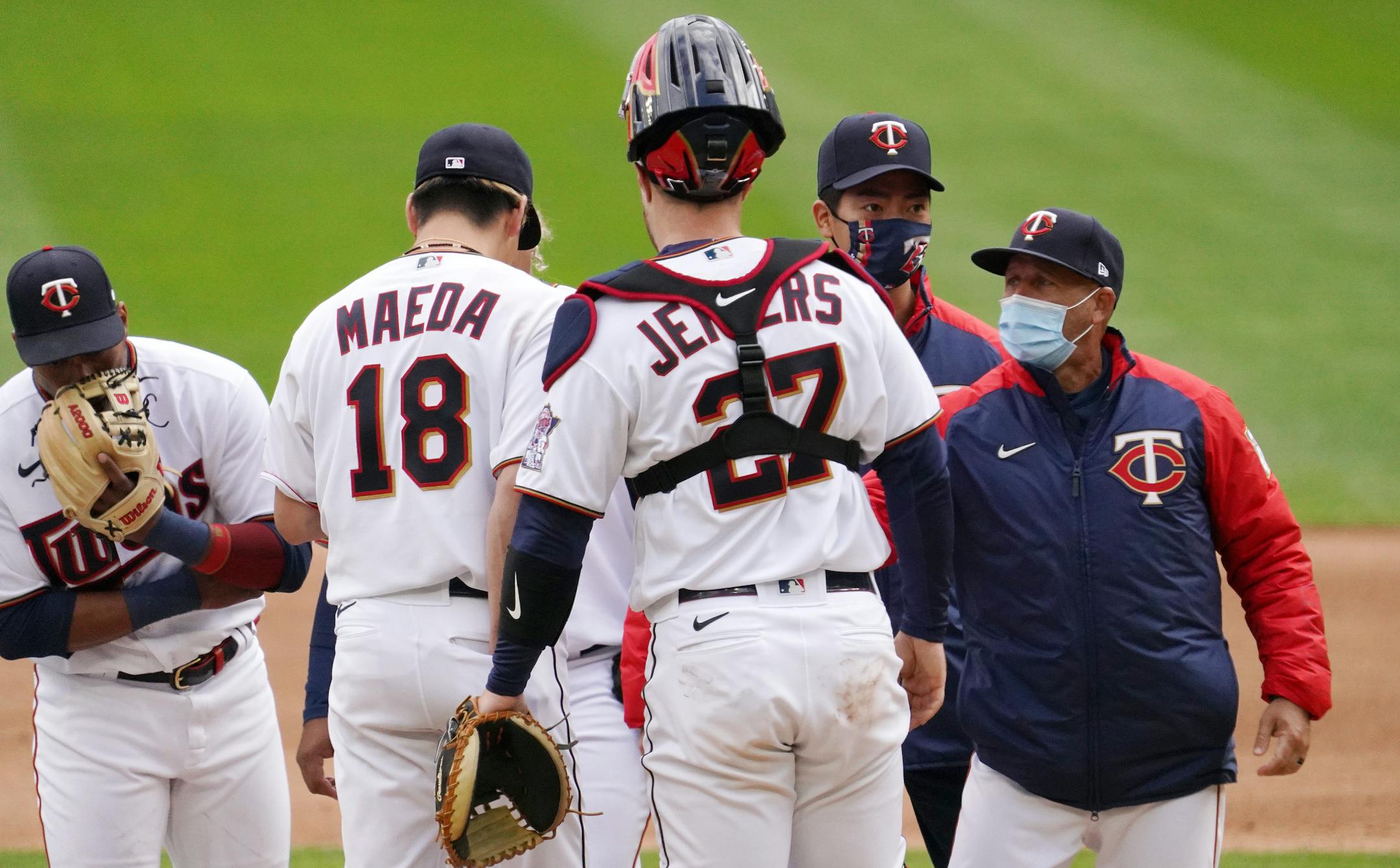 Minnesota Twins pitching coach Wes Johnson (47) visited starting pitcher Kenta Maeda (18) on the mound in the second inning.