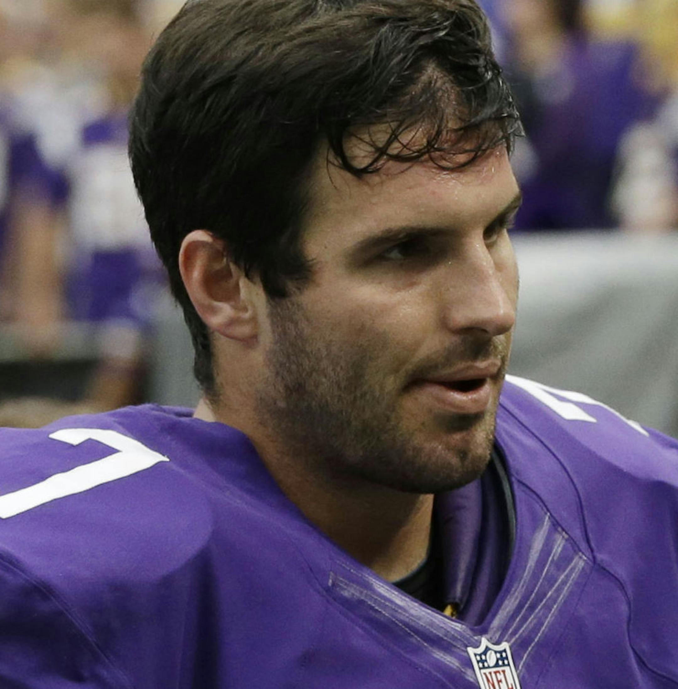 Minnesota Vikings quarterback Christian Ponder walks off the field after a 31-27 loss to the Cleveland Browns in an NFL football game Sunday, Sept. 22, 2013, in Minneapolis. (AP Photo/Jim Mone)