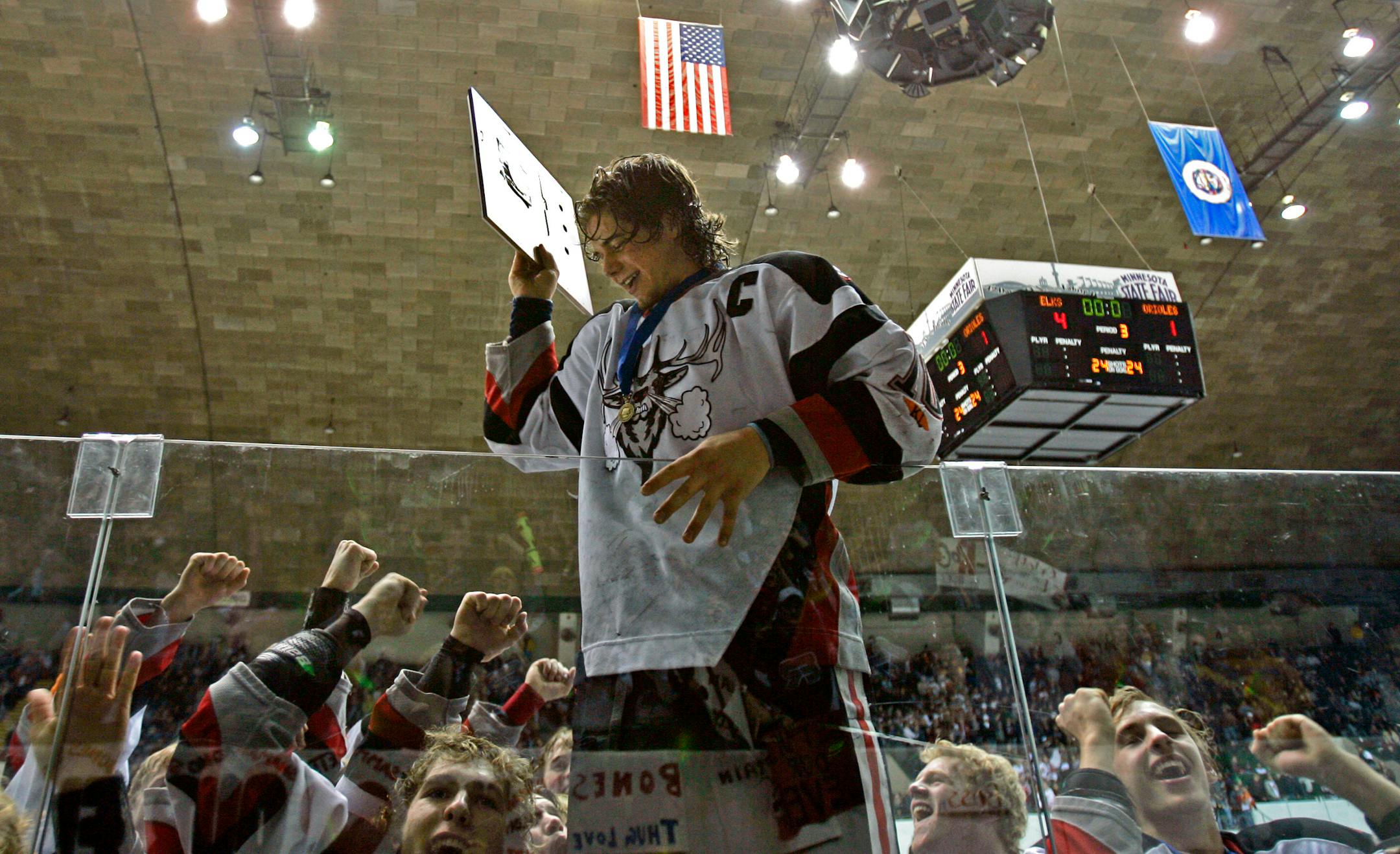 Elk River forward and captain Collin Ostroot celebrates victory over Osseo for the 2005 Class 2A, Section 4 boys' hockey title in front of the student section at the State Fair Grounds Coliseum. The venue will no longer host hockey games after February, 2014.