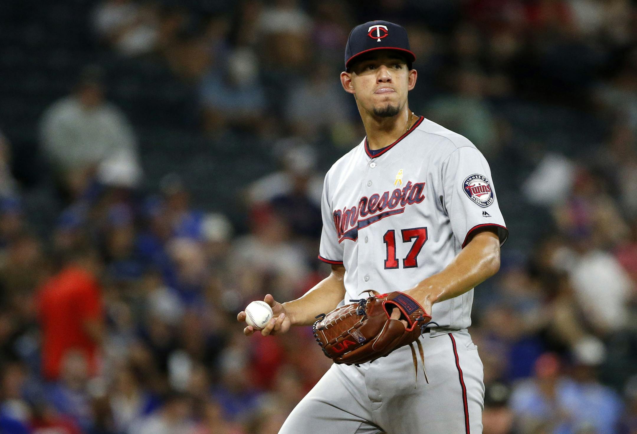 Minnesota Twins starting pitcher Jose Berrios (17) prepares to pitch after giving up a home run to Texas Rangers' Adrian Beltre during the fourth inning of a baseball game, Saturday, Sept. 1, 2018, in Arlington, Texas. (AP Photo/Michael Ainsworth)