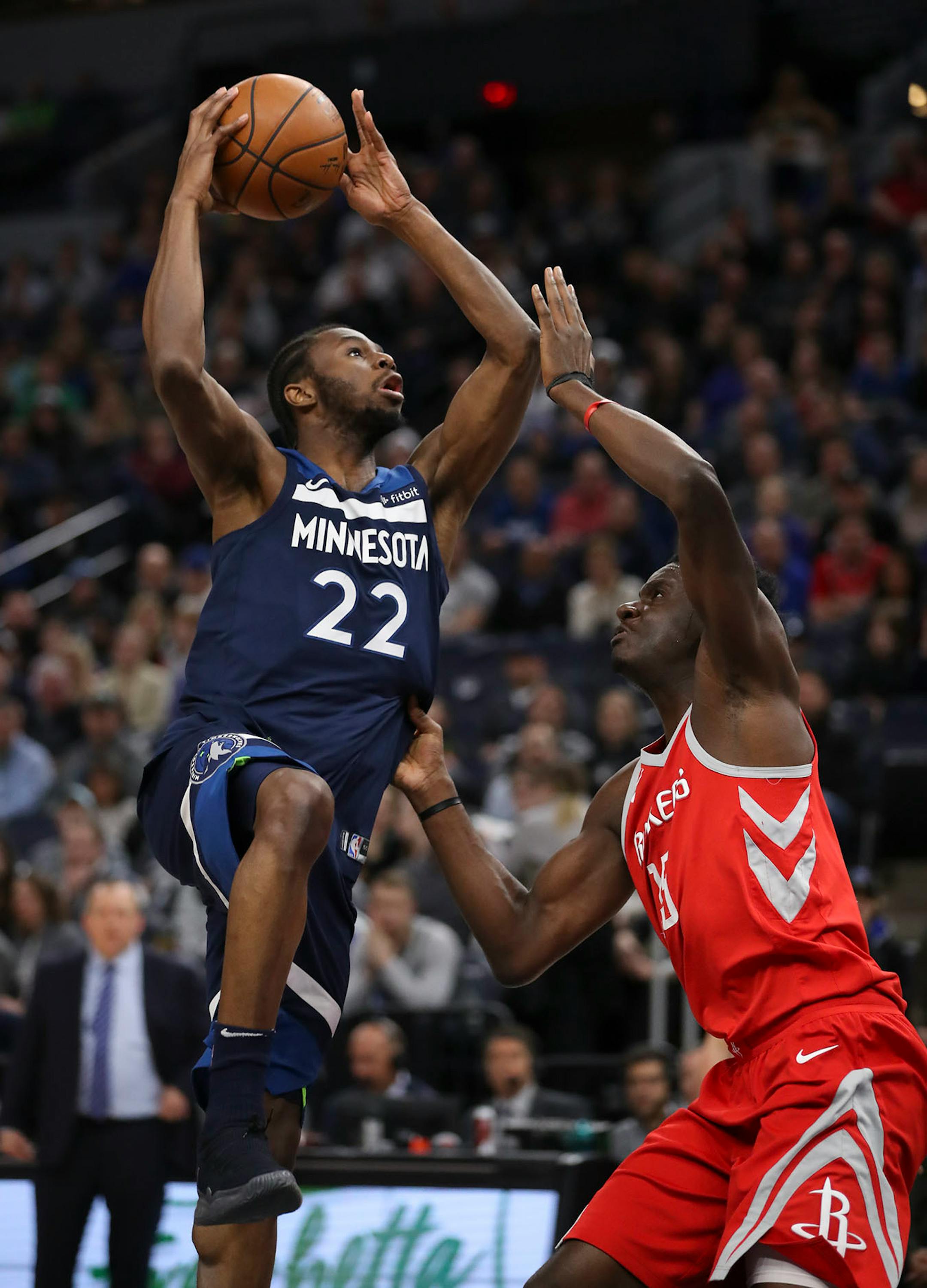Minnesota Timberwolves forward Andrew Wiggins (22) shot over Houston Rockets center Clint Capela (15) in the first quarter.