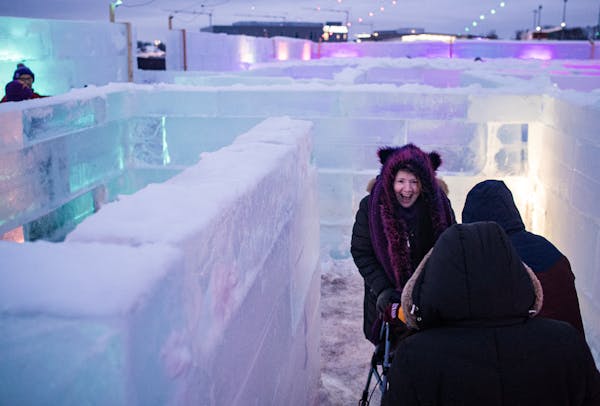Malissa Medina helps Kevin Sullivan, who uses a walker, navigate the Minnesota Ice Maze in Eagan on Jan. 12, 2023.
