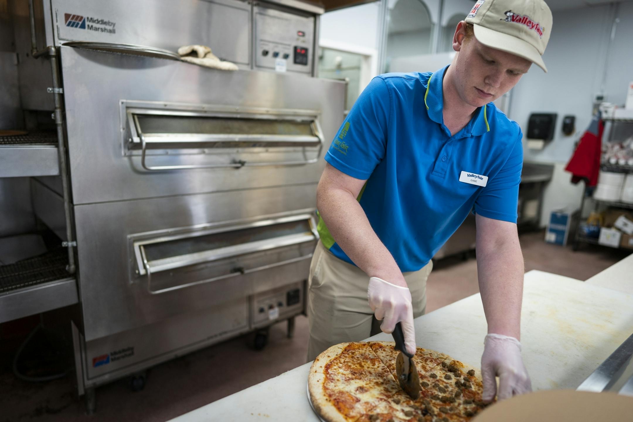 Gabe Stoesz, 19, of Waseca works in Mama Chetta's Pizzeria at ValleyFair.