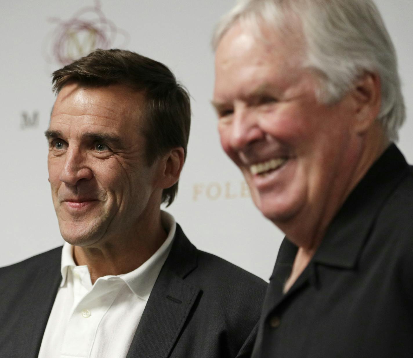 FILE - In this Wednesday, July 13, 2016, file photo, George McPhee, left, and NHL's expansion Las Vegas franchise owner Bill Foley attend a news conference in Las Vegas. Preparations for the Vegas Golden Knights&#xed; NHL hockey expansion draft is well underway around the NHL. Vegas general manager McPhee and his colleagues are in the process of putting together mock-ups and getting ready for June, the league&#xed;s first expansion draft since 2000. (AP Photo/John Locher, File) ORG XMIT: NYSB111