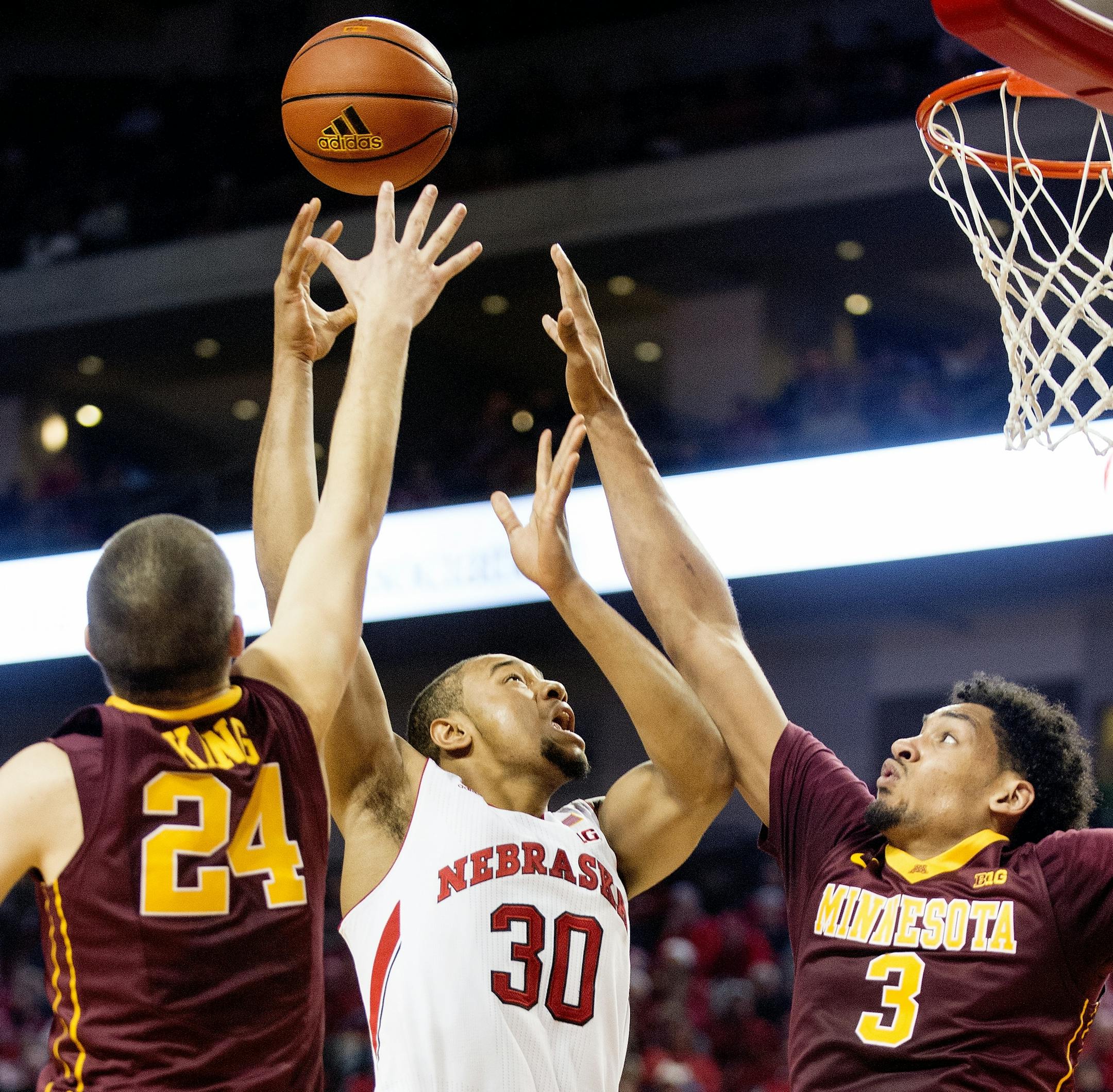 Nebraska forward Ed Morrow Jr. (30) shoots between Minnesota forward Joey King (24) and forward Jordan Murphy (3) during the second half of an NCAA college basketball game in Lincoln, Neb., Tuesday, Jan. 12, 2016. (Francis Gardler/The Journal-Star via AP) LOCAL TELEVISION OUT; KOLN-TV OUT; KGIN-TV OUT; KLKN-TV OUT; MANDATORY CREDIT