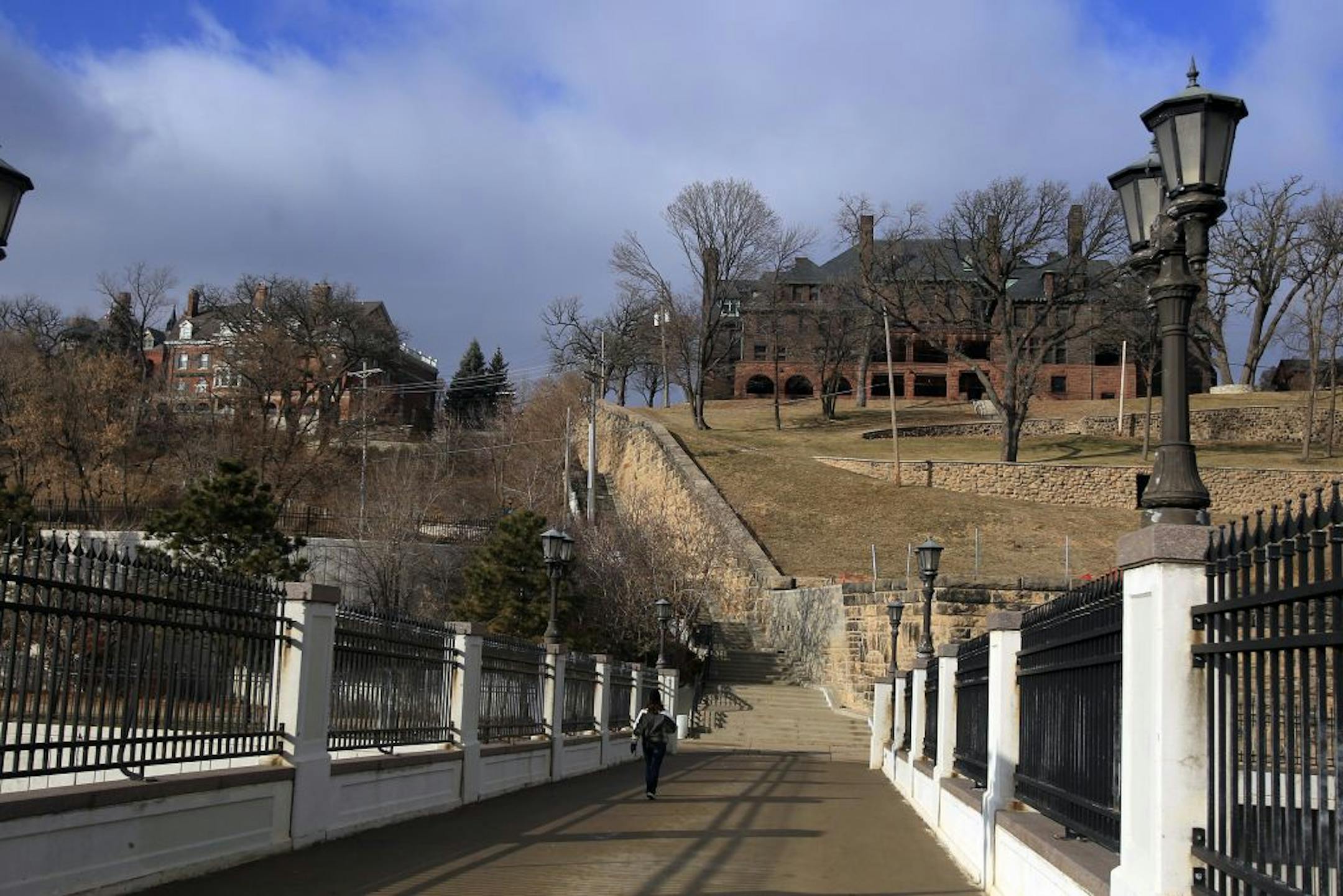 A more than 100-year-old legal document has St. Paul City Hall and a Summit Avenue property owner trying to figure out who pays for a new $1 million staircase and retaining wall. The historic stairwell threads the bluff from downtown up to Summit Avenue. The entry point up top is adjacent to the J.J. Hill House. A century ago, the property owner gave the city an easement but agreed to foot the bill for the stairs. The James J. Hill mansion is at right.