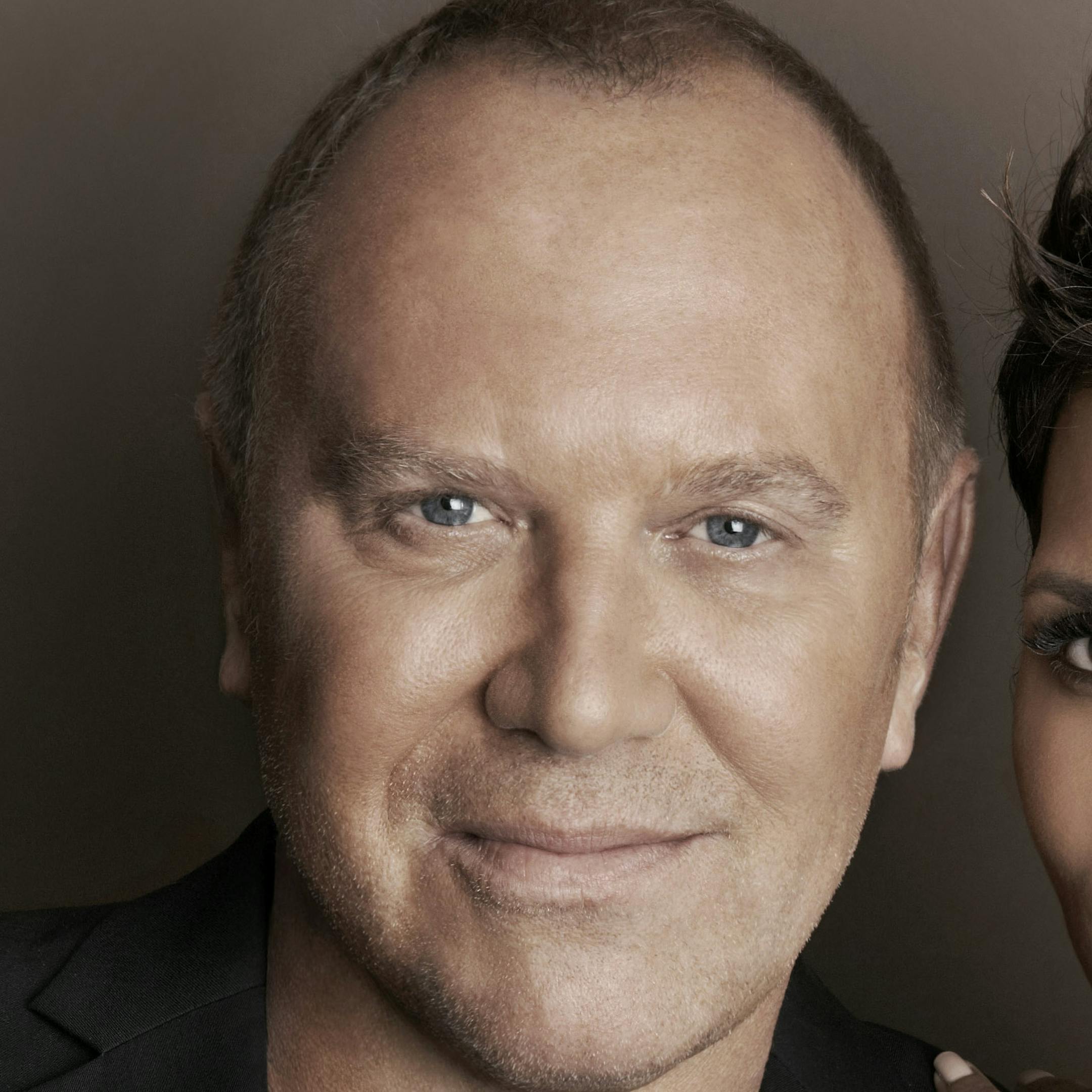 In this April 6, 2013 photo provided by Michael Kors, Kors and actress Halle Berry pose for a photo at Kors' Midtown office in New York. Kors and Berry have announced a partnership with the U.N. World Food Programme to raise money and awareness to tackle the issue of world hunger. (AP Photo) ORG XMIT: MIN2013040810231140
