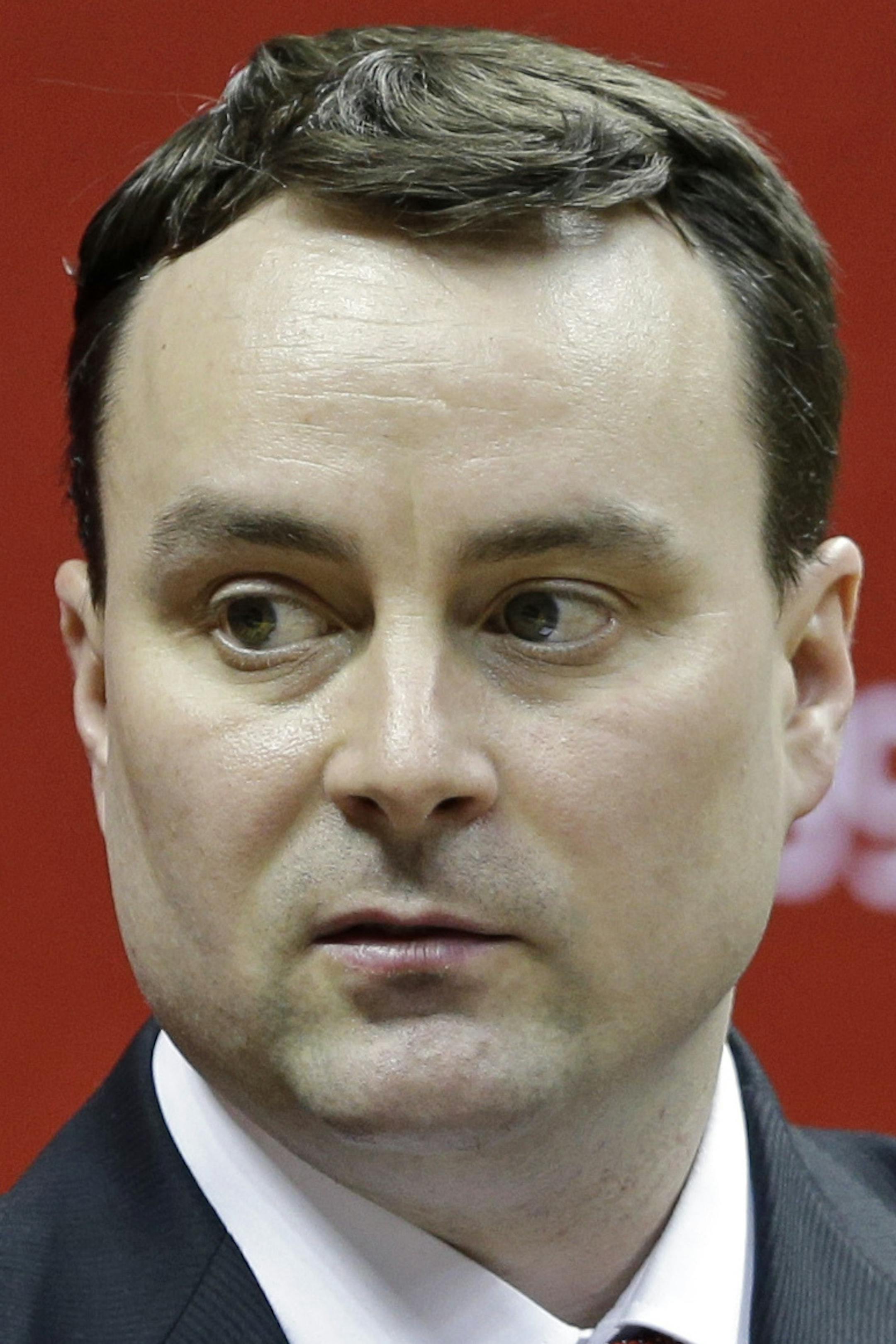 New Indiana NCAA college basketball coach Archie Miller answers a question during a news conference on the court in Assembly Hall after he was introduced in Bloomington, Ind., Monday, March 27, 2017. (AP Photo/Michael Conroy)