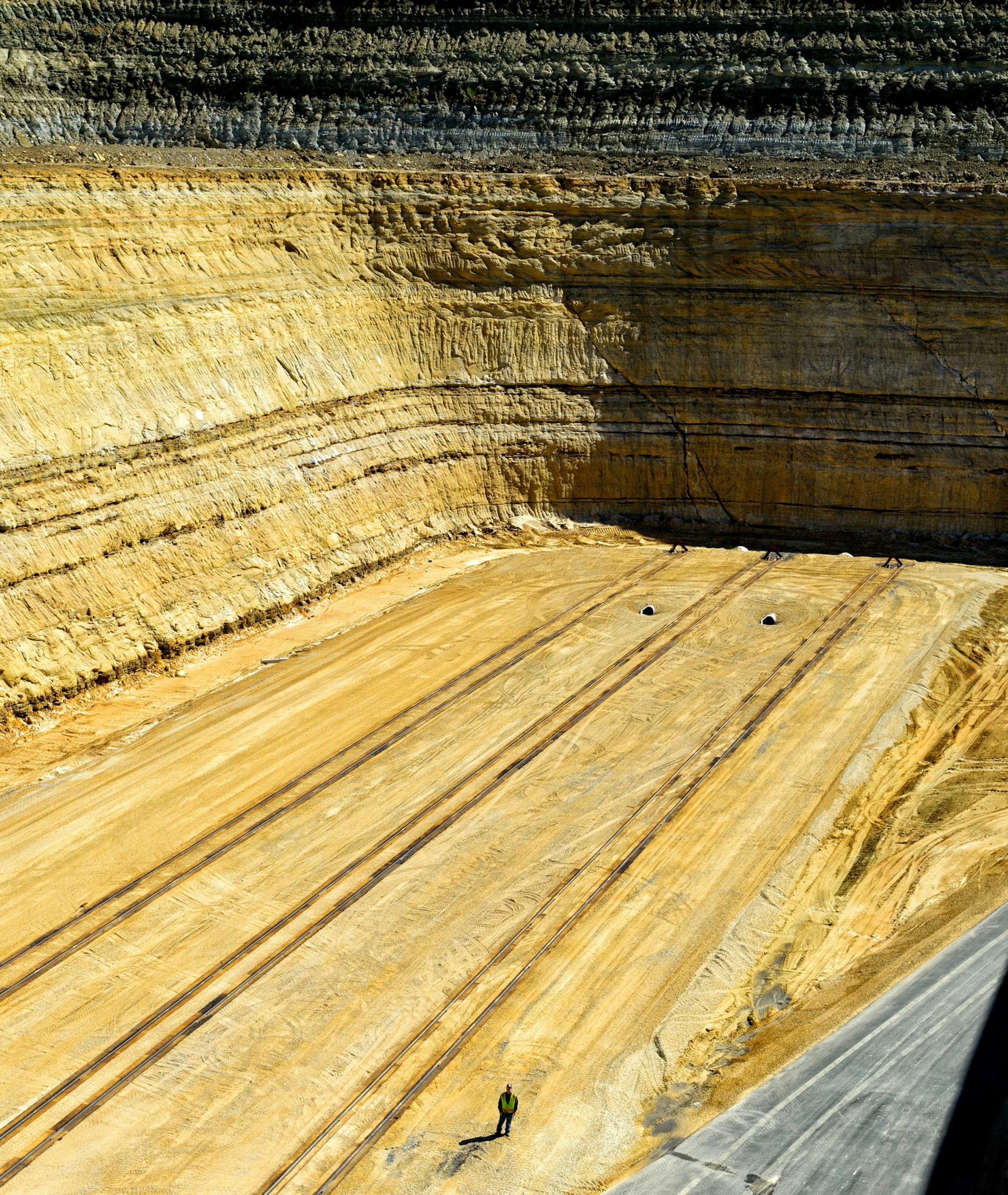The Unimin Tunnel city frac sand mine and processing facility was placed in an excavated pit to keep noise and visibility as low as possible. A safety officer supervised the raising of construction materials to the top of the plant. could be the largest in the country once it begins digging and processing the silica sand that is integral to the oil and natural gas drilling boom in the U.S. Friday, September 13, 2013 ] GLEN STUBBE * gstubbe@startribune.com ORG XMIT: MIN1309161731464057