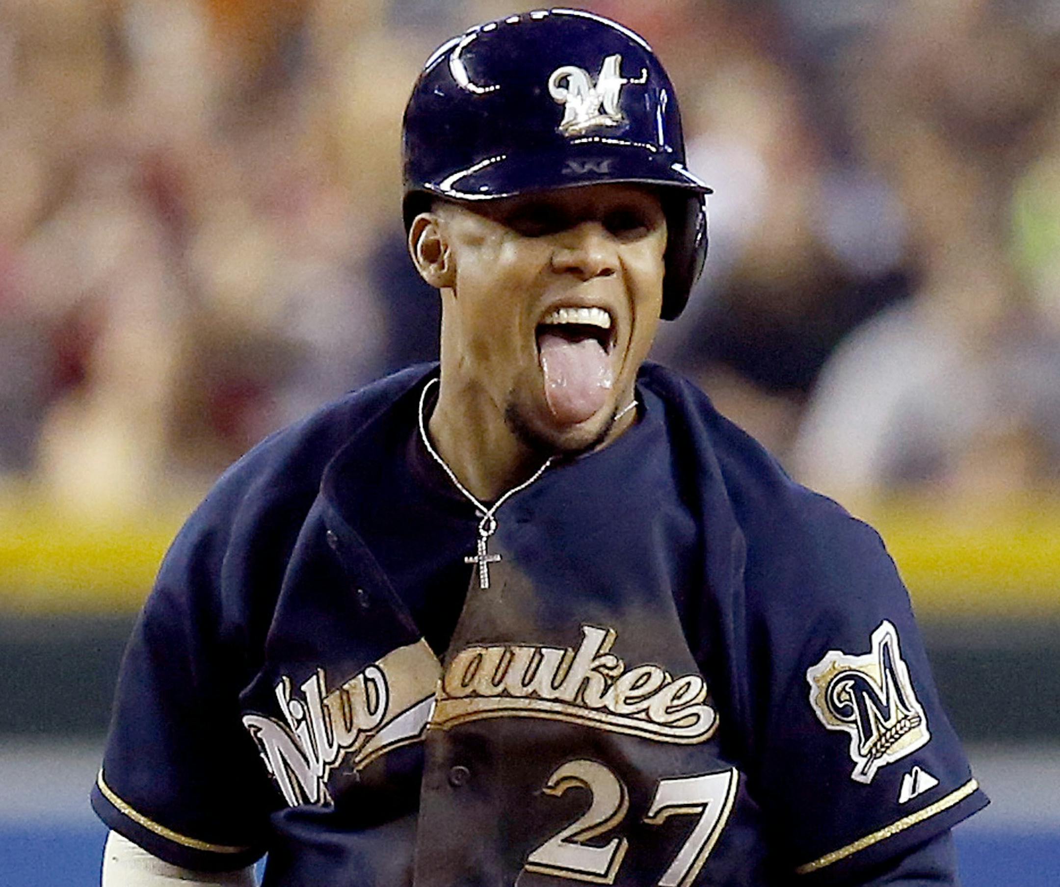 Milwaukee Brewers' Carlos Gomez celebrates his run-scoring hit against the Arizona Diamondbacks during the eighth inning of a baseball game on Thursday, June 19, 2014, in Phoenix. Gomez was called out at second base as he tried to stretch a single into a double, but the Brewers defeated the Diamondbacks 4-1. (AP Photo/Ross D. Franklin) ORG XMIT: PNC115