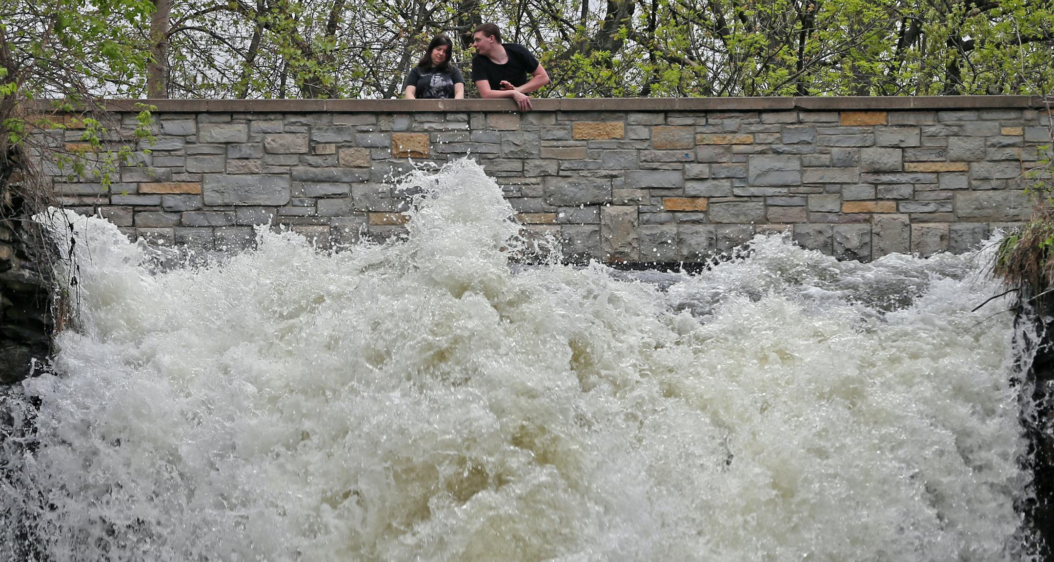 A couple checked out the fast water flow just above Minnehaha Falls.