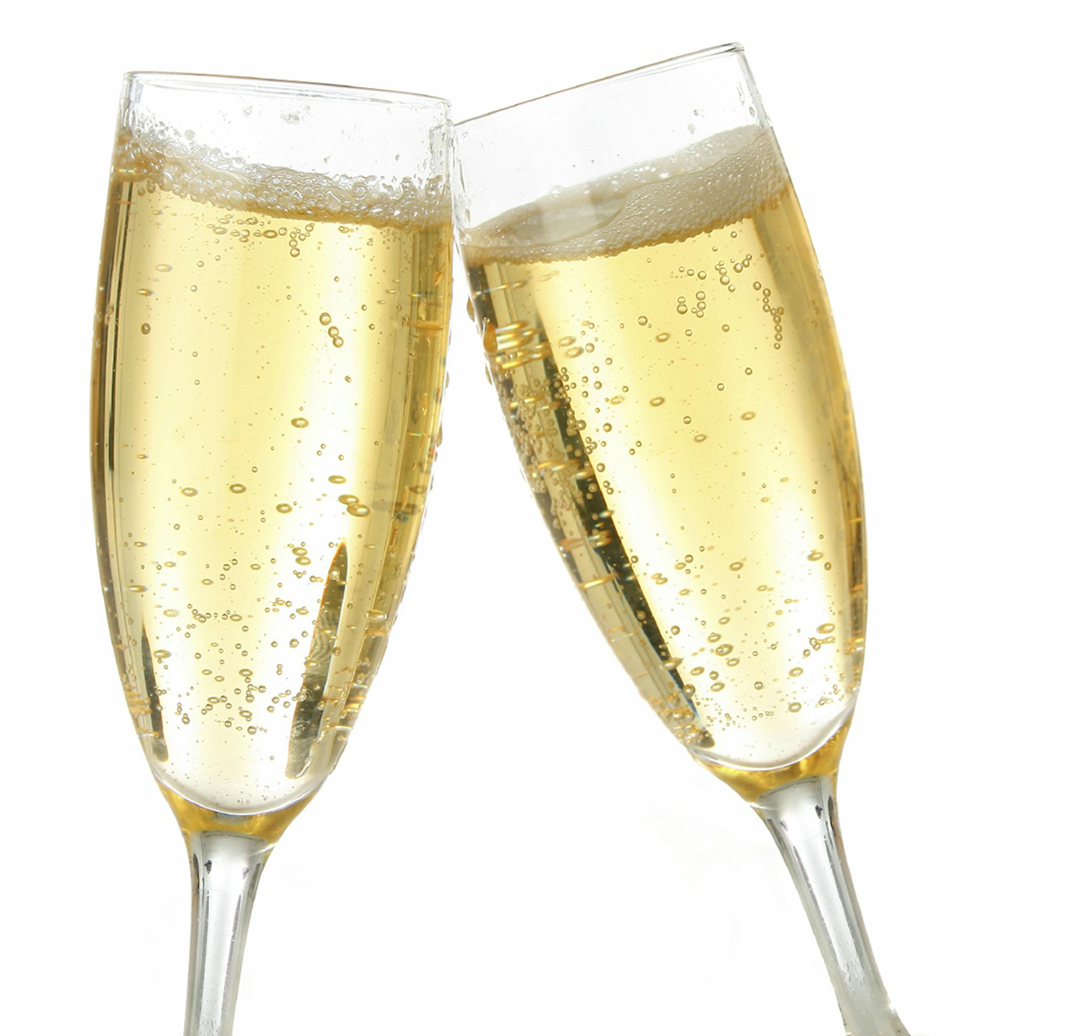 Pair of champagne flutes making a toast.