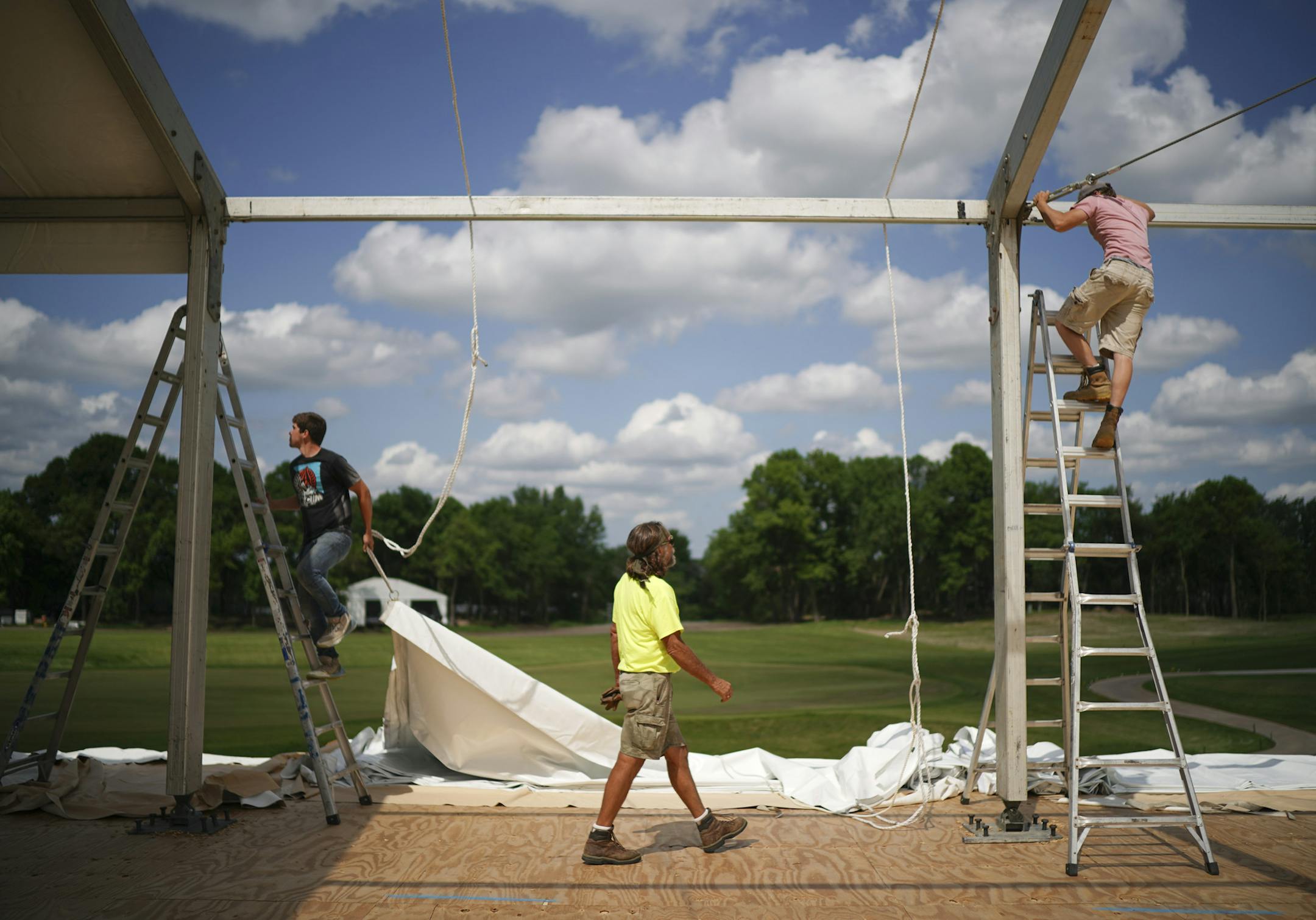 Josh Smothers, Bob Basche, and Taylor Mayes, from left, assembled a tent for entertaining VIP's on the grounds of TPC Wednesday afternoon. ] JEFF WHEELER &#x2022; jeff.wheeler@startribune.com The 3M Open marks the PGA Tour's return to Minnesota after 50 years and is being touted as the biggest event ever to come to Blaine. Preparations were in full swing at Tournament Players Club and on city streets near the course Wednesday afternoon, June 5, 2019 in Blaine.