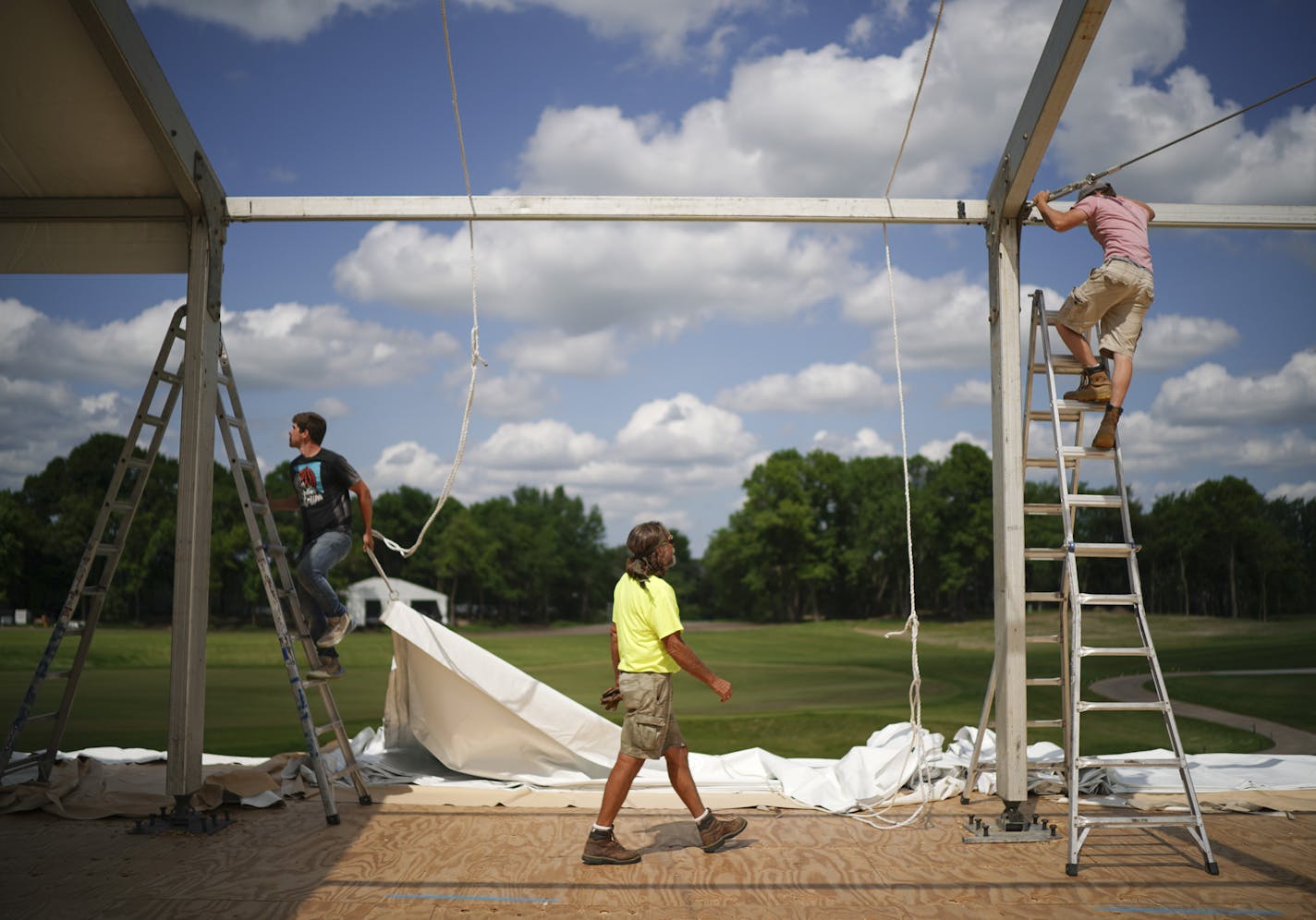 Josh Smothers, Bob Basche, and Taylor Mayes, from left, assembled a tent for entertaining VIP's on the grounds of TPC Wednesday afternoon. ] JEFF WHEELER &#x2022; jeff.wheeler@startribune.com The 3M Open marks the PGA Tour's return to Minnesota after 50 years and is being touted as the biggest event ever to come to Blaine. Preparations were in full swing at Tournament Players Club and on city streets near the course Wednesday afternoon, June 5, 2019 in Blaine.