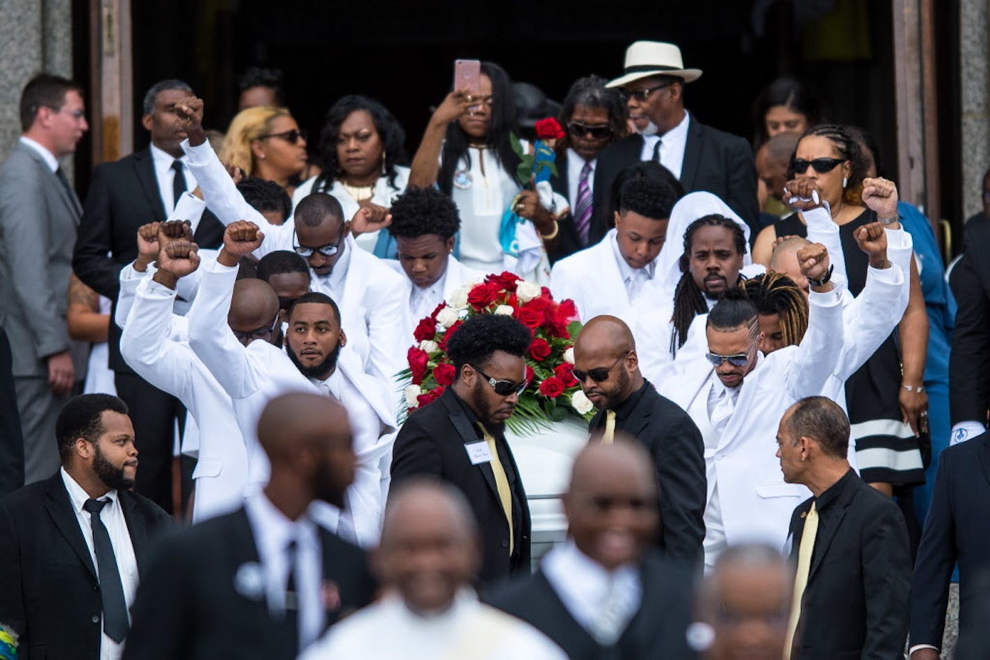 Pallbearers carrying the casket of Philando Castile left the cathedral with fists raised at the Cathedral of St. Paul.