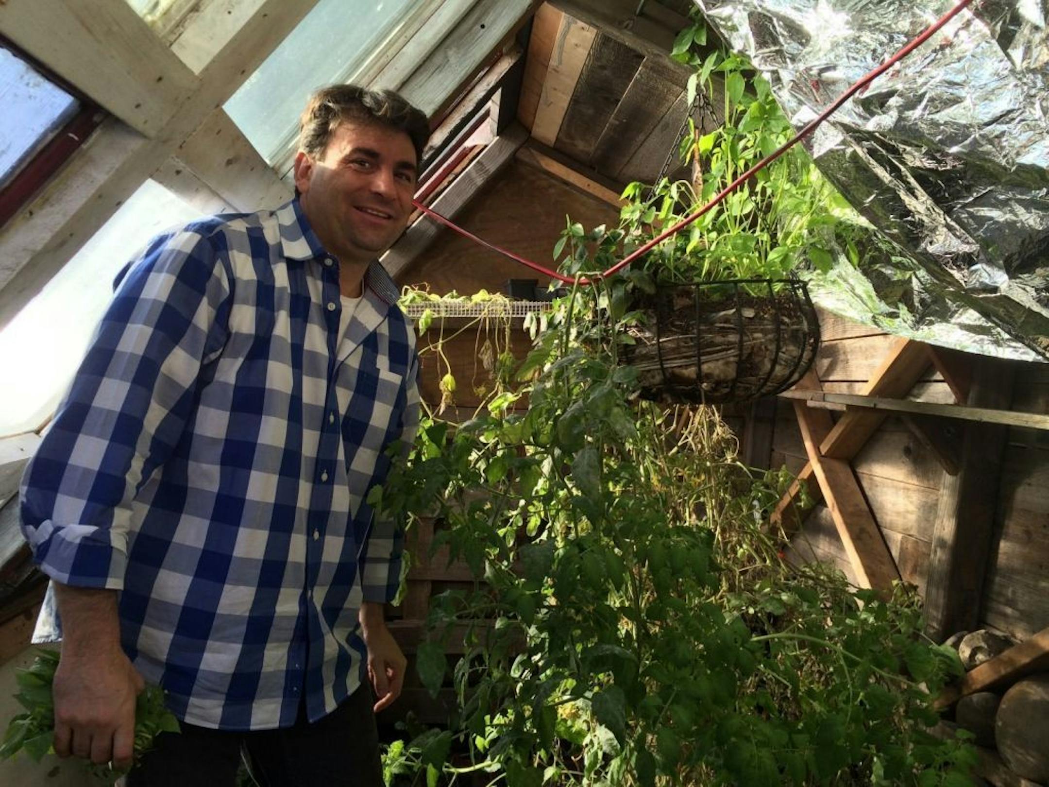 Volunteer Greg Strong inside the walipini