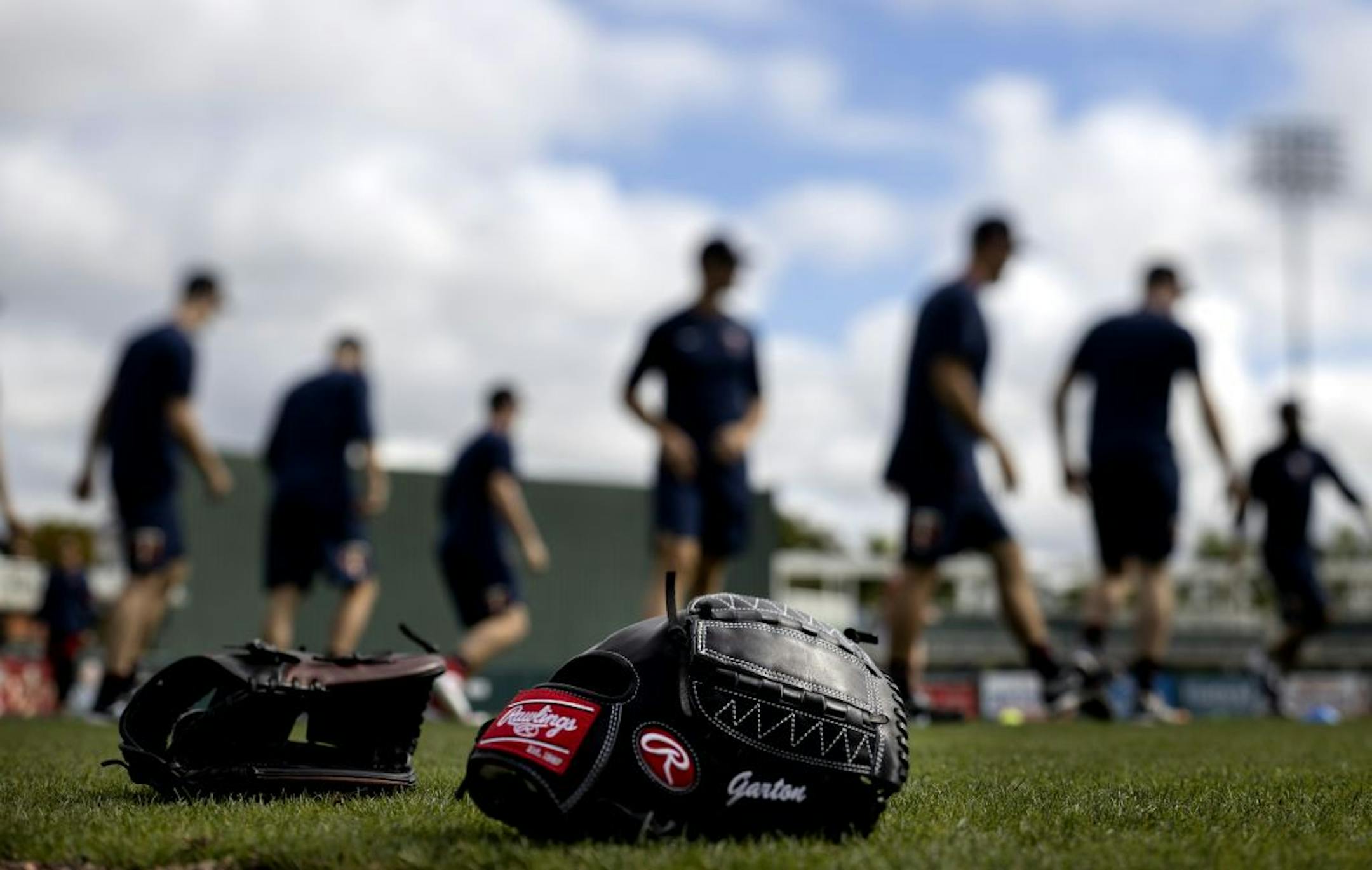 Minnesota Twins pitchers warmed up before practice on Sunday.