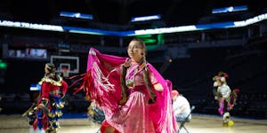 Fancy shawl dancer Caley Coyne, 19, of St. Paul performs moments after Alissa Pili arrived in Target Center for a surprise welcome event. Coyne also i