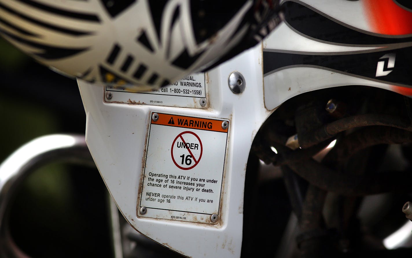 Despite labels on adult sized ATVs from manufacturers warning that children under the age of 16 should not operate the machines, many of the students at the DNR safety course rode the vehicles. ] JIM GEHRZ &#xef; jgehrz@startribune.com / Farmington, MN 6/28, 2014 / 9:00 AM / BACKGROUND INFORMATION: The Minnesota DNR conducted a training class for ATV riders, particularly aimed at younger riders at the Dakota County Fairgrounds in Farmington. Jay Peterson was among the instructors. This is hands