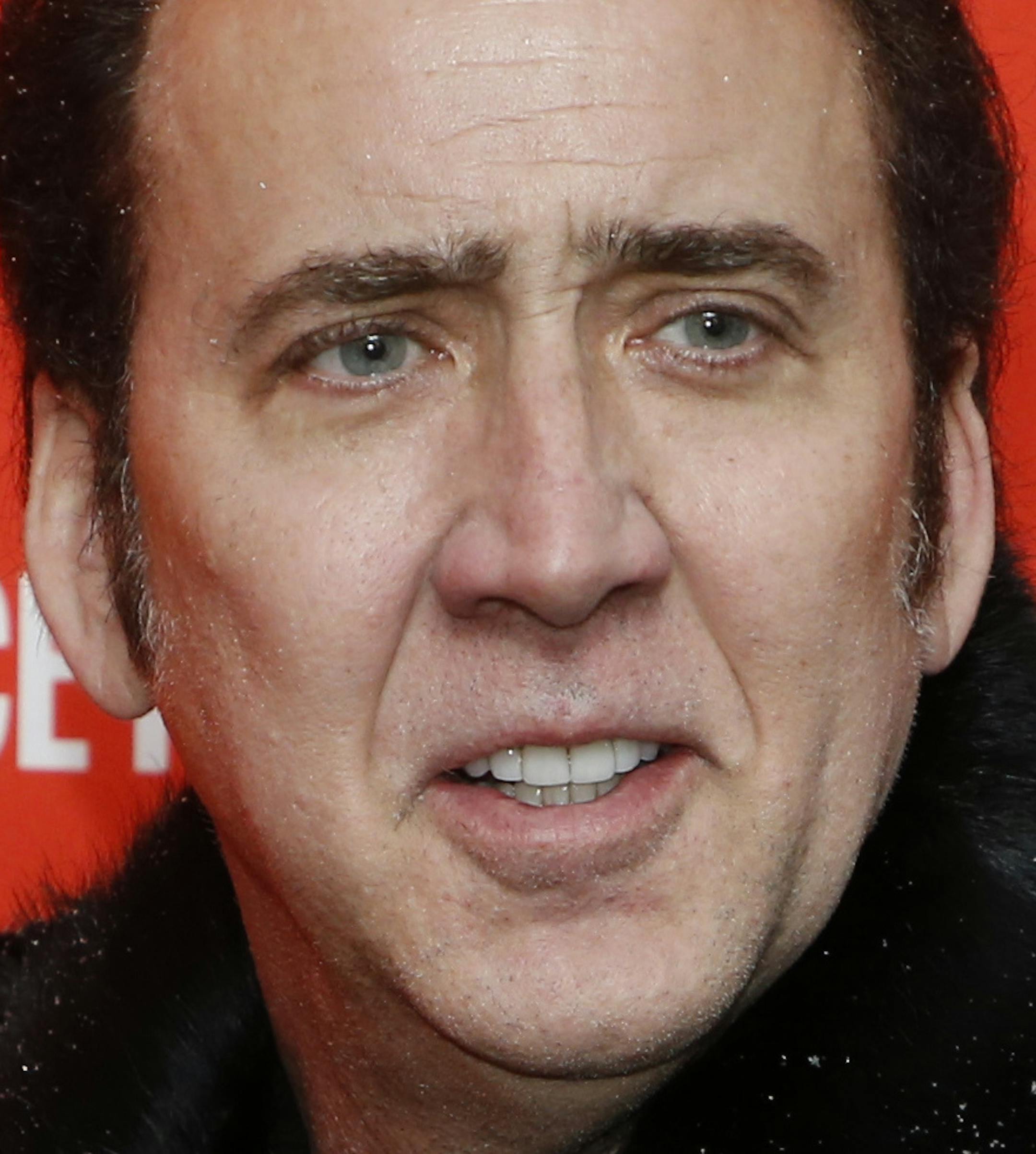 FILE - In this Jan. 19, 2018 file photo, actor Nicolas Cage poses at the premiere of "Mandy" during the 2018 Sundance Film Festival in Park City, Utah. Cage will be voicing Superman in the upcoming film "Teen Titans GO! to the Movies." (Photo by Danny Moloshok/Invision/AP, File) ORG XMIT: NJSM301