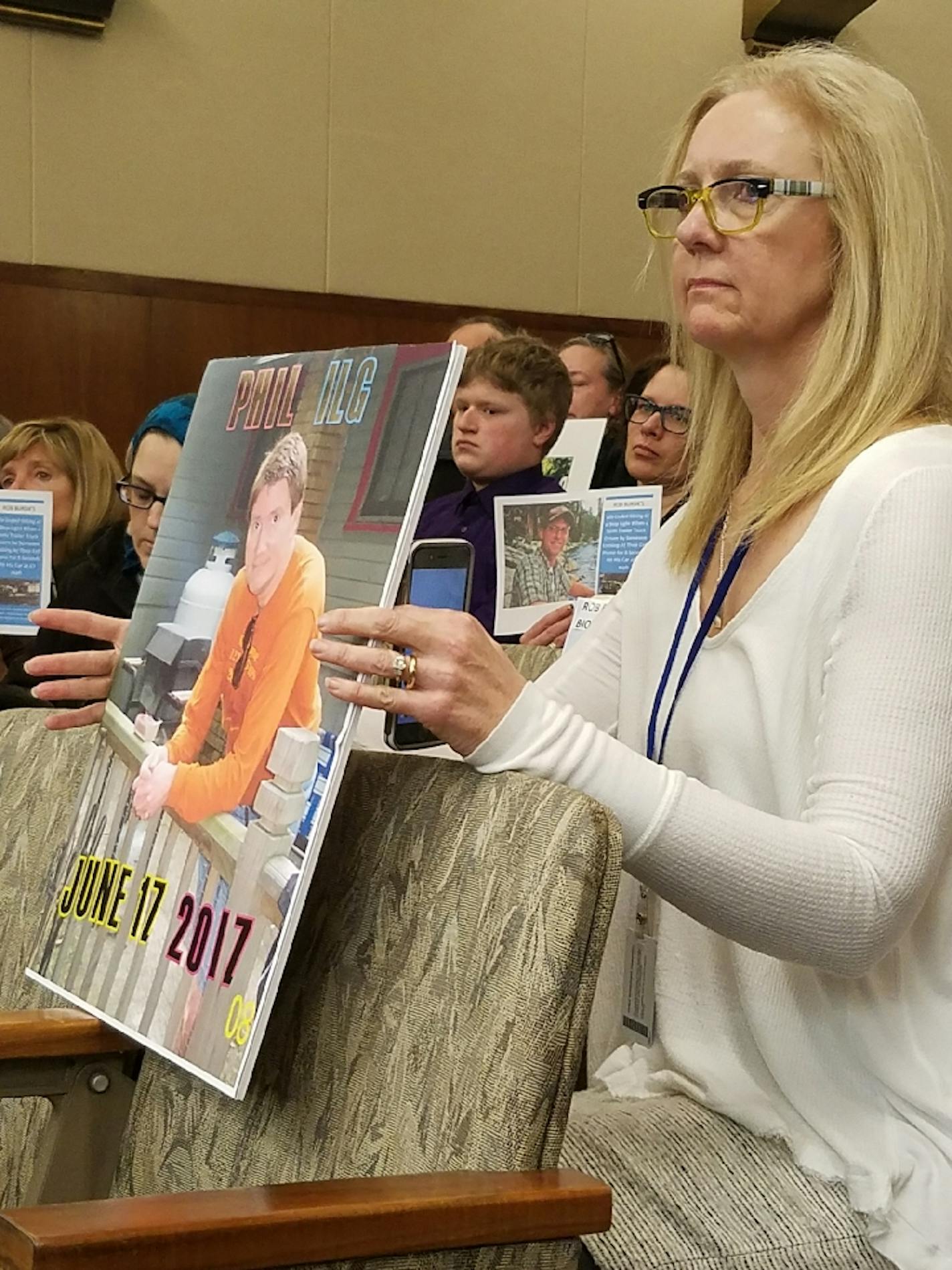 Karin Ilg, of New Prague, held a photo of husband, Phillip, who was killed last June. He was bicycling 56 miles in honor of his 56 birthday when hit by a 16-year-old driver on Snapchat.