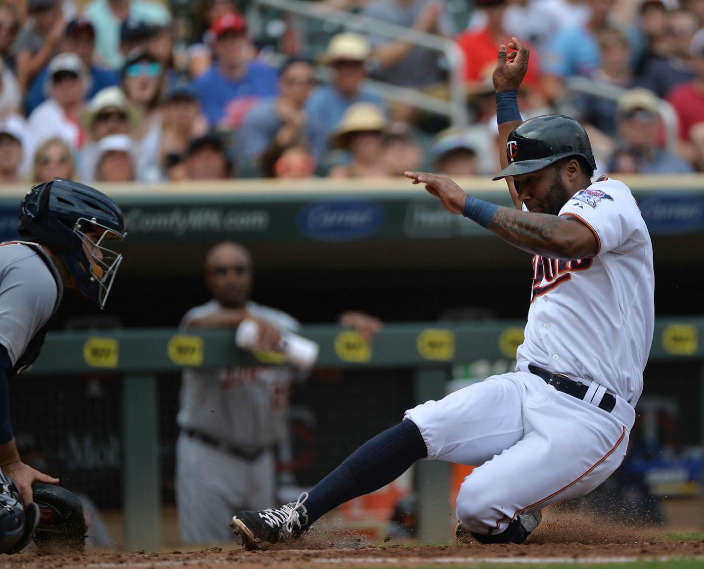 Minnesota Twins Danny Santana slid into home base in the fourth inning. ] RACHEL WOOLF &#xb7; rachel.woolf@startribune.com The Minnesota Twins faced the Detroit Tigers at Target Field in Minneapolis, Minn., on Sunday July 12, 2015. The Twins beat the Tigers 7-1. ORG XMIT: MIN1507121704070327