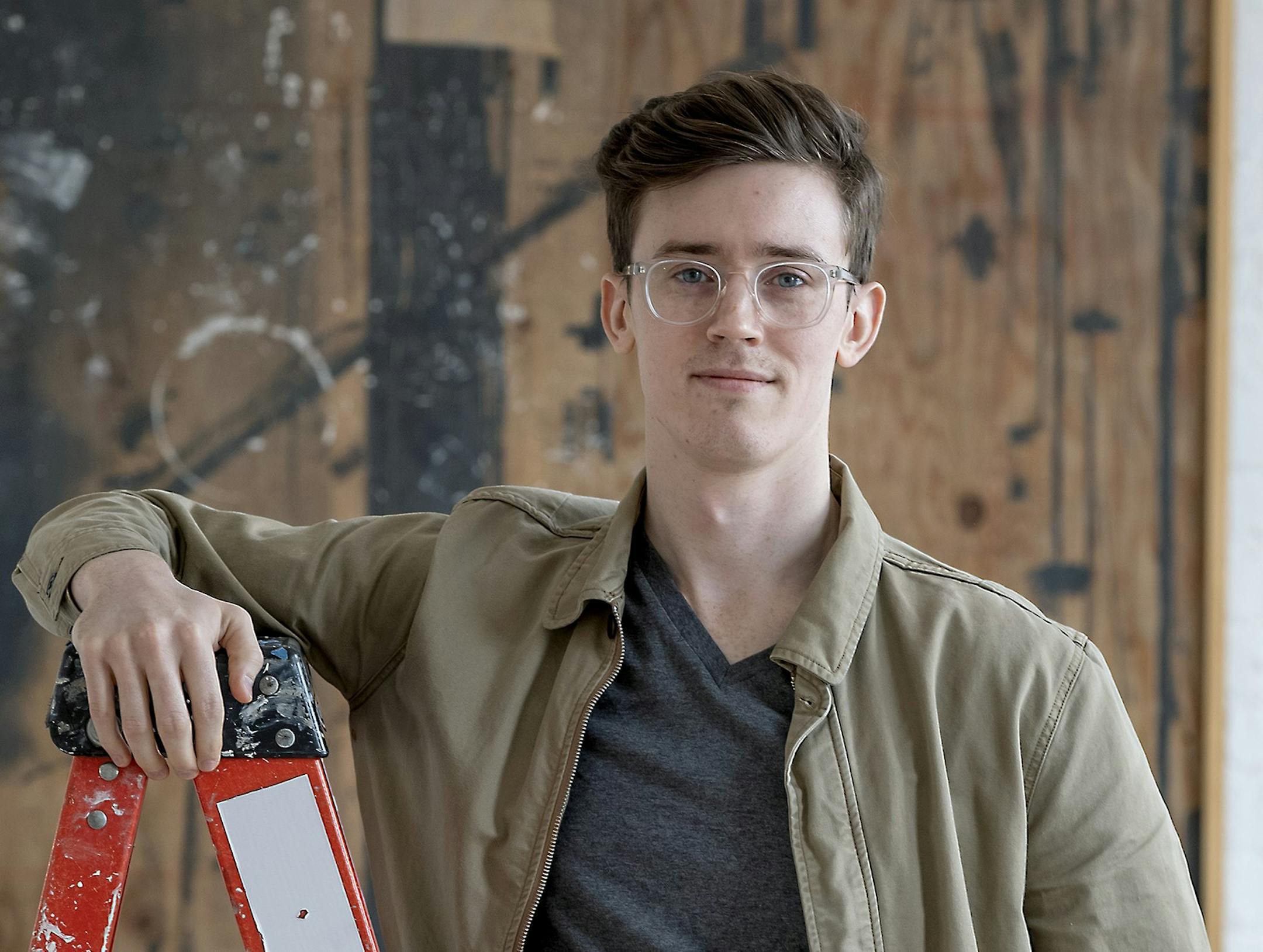 Luke Nichols, a recent U of M graduate who is a champion of affordable housing, was photographed in his office.