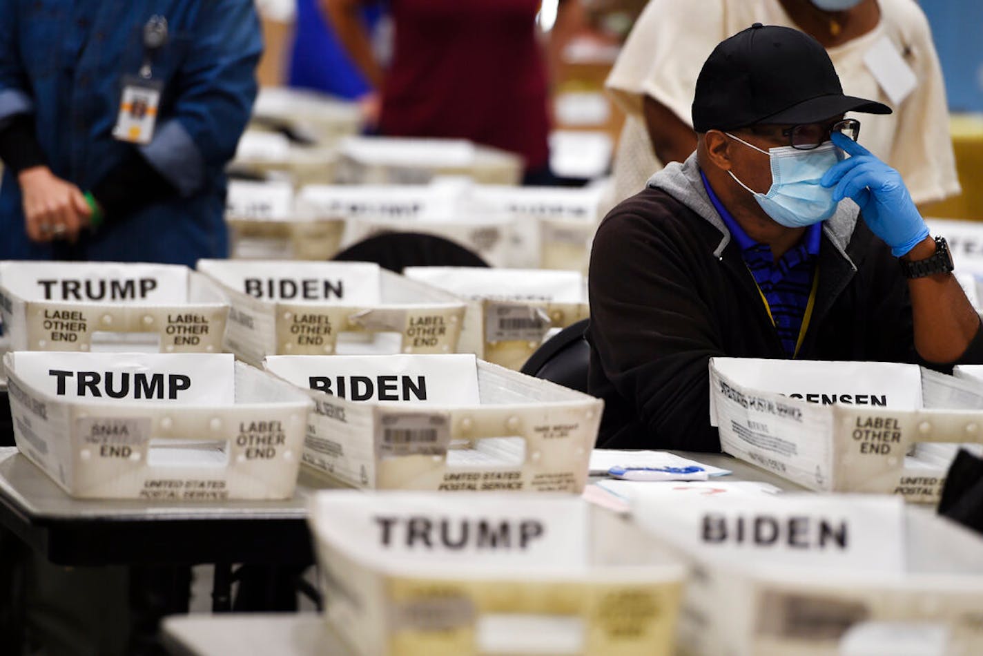 Cobb County Election official sort ballots during an audit, Friday, Nov. 13, 2020, in Marietta, Ga. (AP Photo/Mike Stewart)