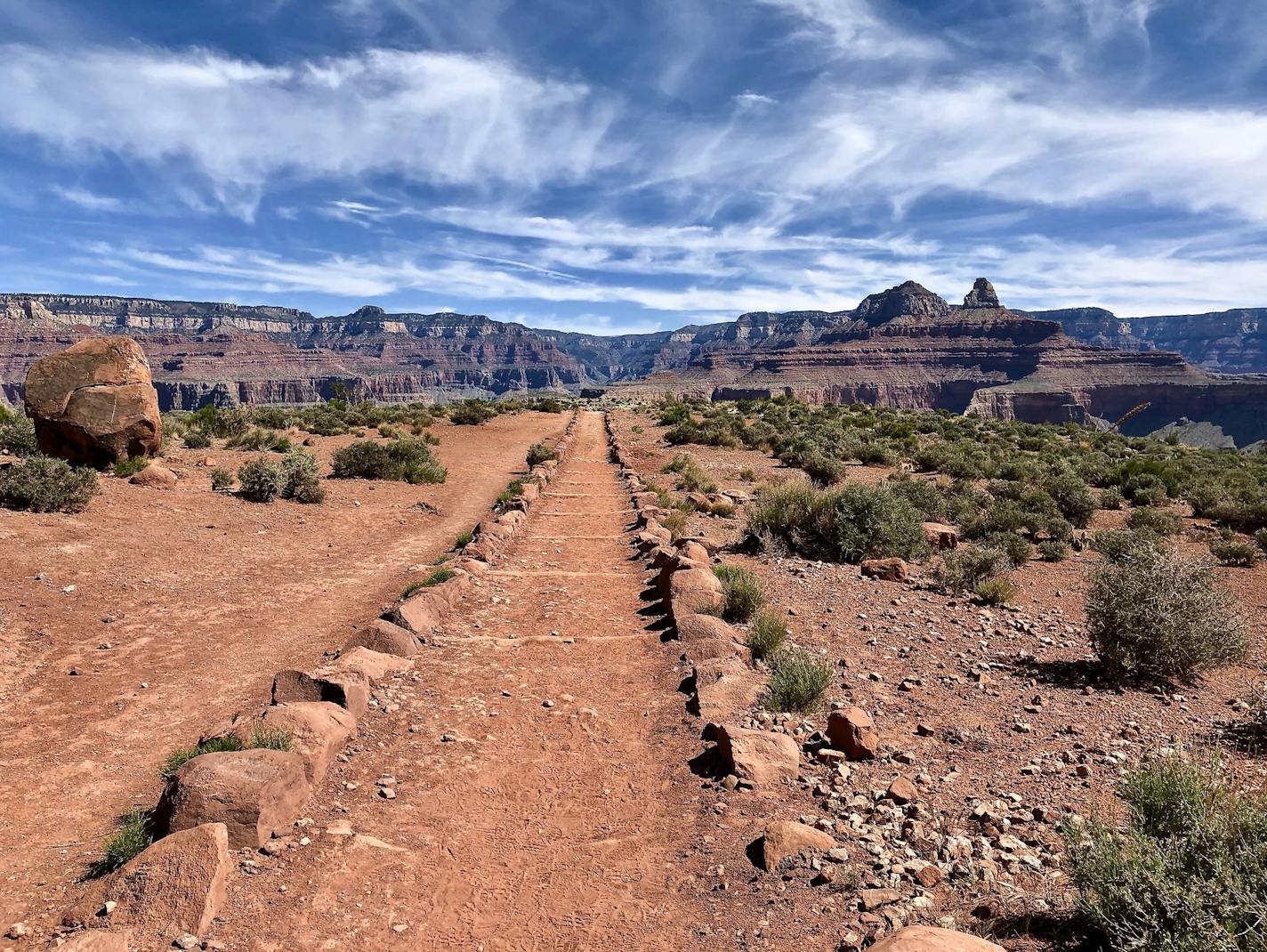 Hiking the Grand Canyon in one day, down and up, requires an early start, but the rewards include beautiful vistas and snow on the North Rim.