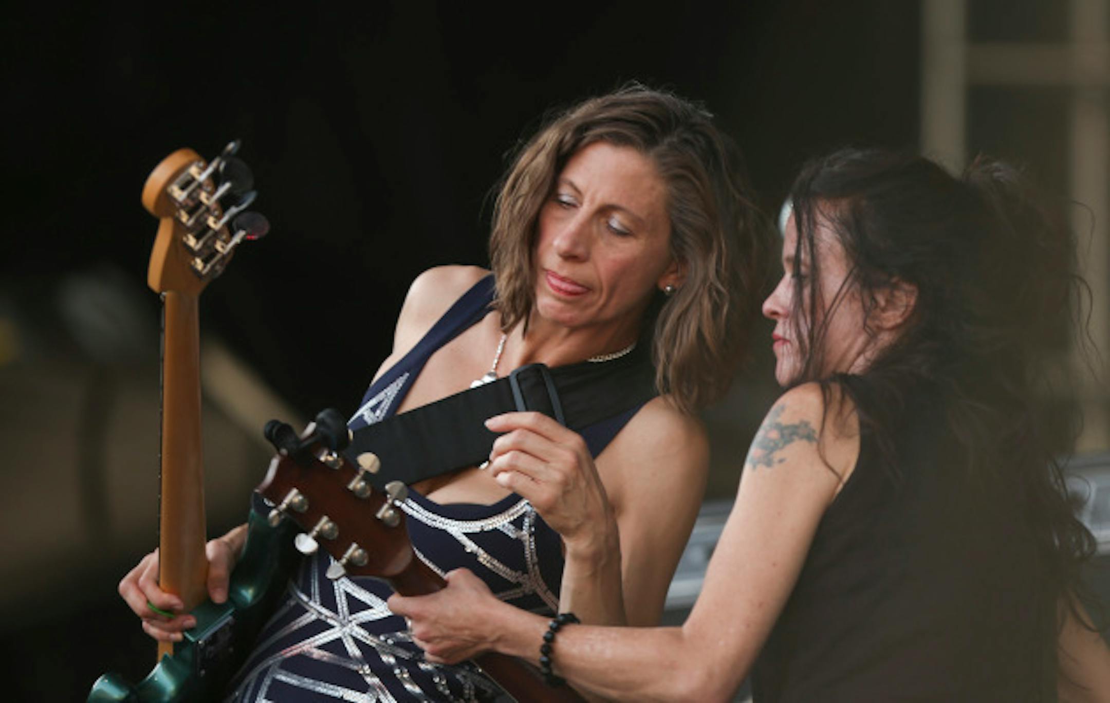 Maureen Herman, left, and Kat Bjelland conferred between songs when Babes in Toyland played Rock the Garden in June outside Walker Art Center in Minneapolis. / Jeff Wheeler, Star Tribune