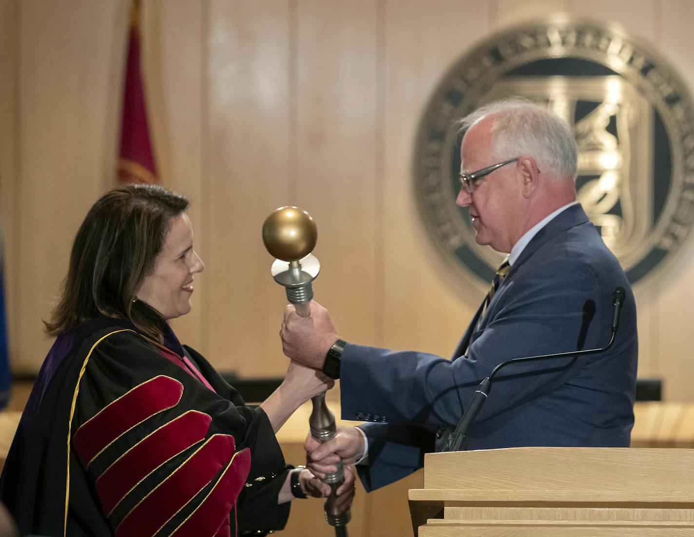 Gov. Tim Walz at last month's inauguration of University of Minnesota President Joan Gabel. Walz on Tuesday said he is "certainly willing to look at" legislation that would allow college athletes in Minnesota to hire agents and make money off endorsements.