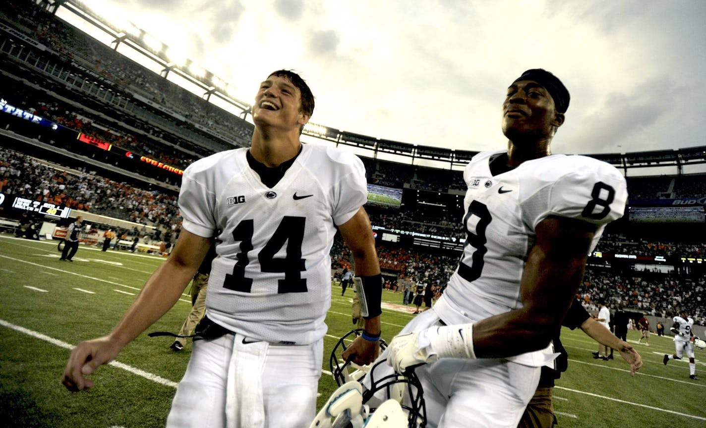 Penn State's Christian Hackenberg (14) and Allen Robinson celebrate after a 23-17 victory against Syracuse at MetLife Stadium in East Rutherford, New Jersey, on Saturday, August 31, 2013. (Nabil K. Mark/Centre Daily Times/MCT)