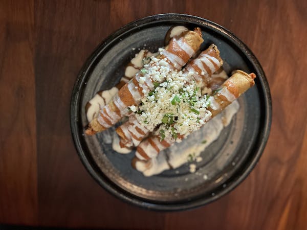 The flautas on the appetizer menu are tortillas wrapped around potato before being fried crispy and served under sauce.