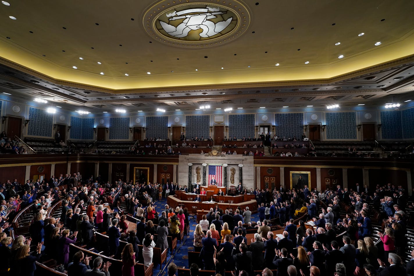 Both Republicans and Democrats stand as House Minority Leader Hakeem Jeffries of N.Y., speaks about Israel after Republicans elected Rep. Mike Johnson, R-La., to be the new House speaker, at the Capitol in Washington, Wednesday, Oct. 25, 2023. (AP Photo/Alex Brandon)