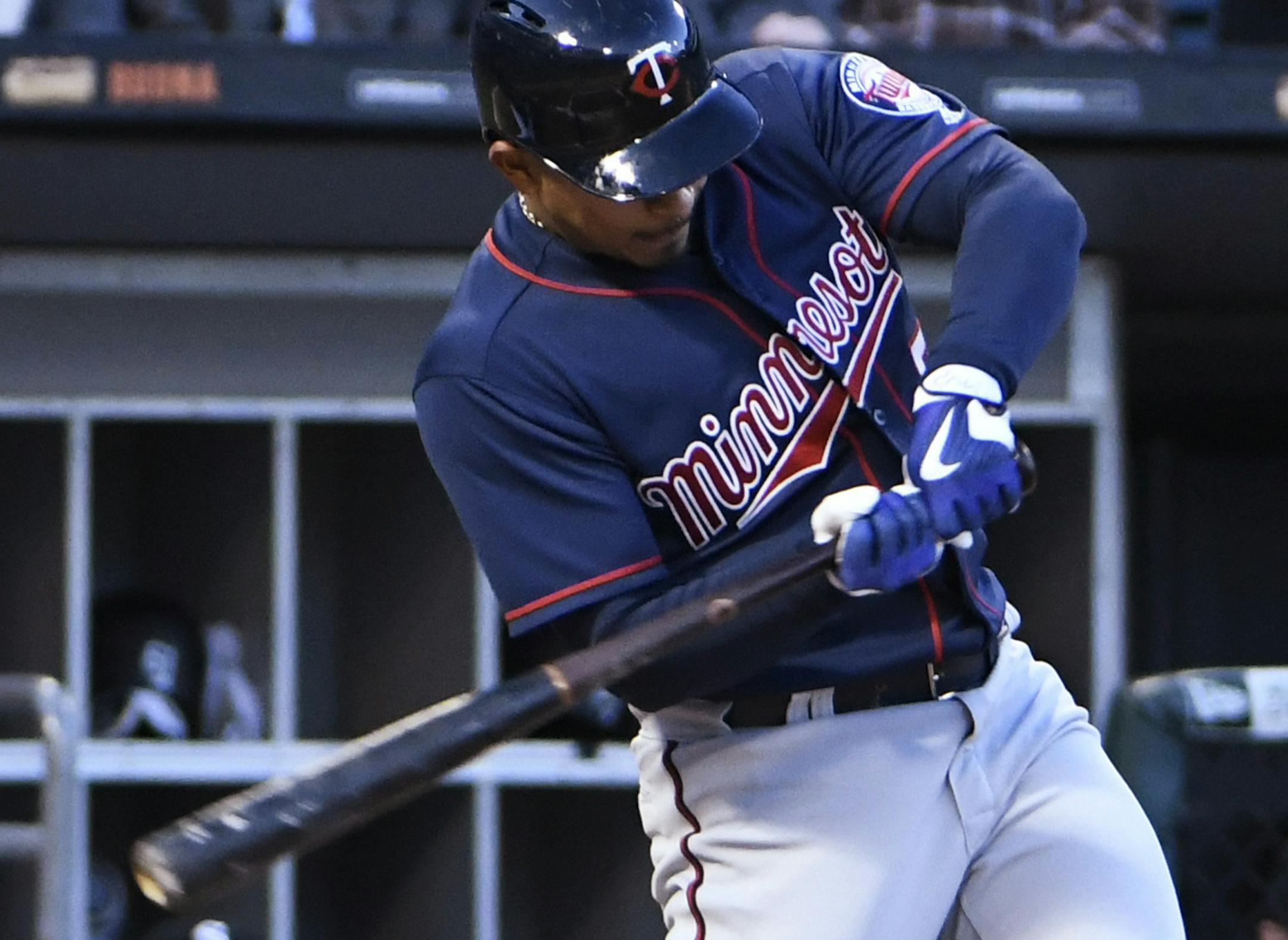 Minnesota Twins' Eduardo Escobar (5) swings into a three-run home run against the Chicago White Sox during the first inning of a baseball game, Thursday, May 11, 2017, in Chicago. (AP Photo/David Banks)