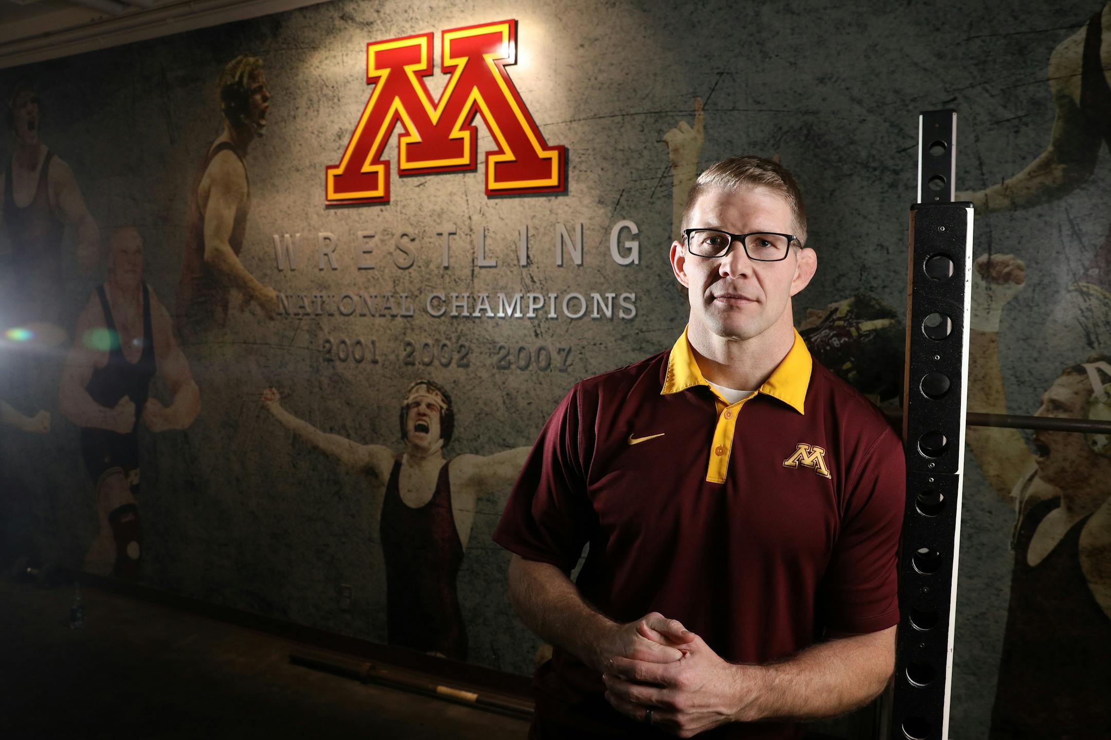 Brandon Eggum, the new wrestling coach for the University of Minnesota's Golden Gophers, stands for a portrait in the university's wrestling room Wednesday. ] ANTHONY SOUFFLE ¥ anthony.souffle@startribune.com