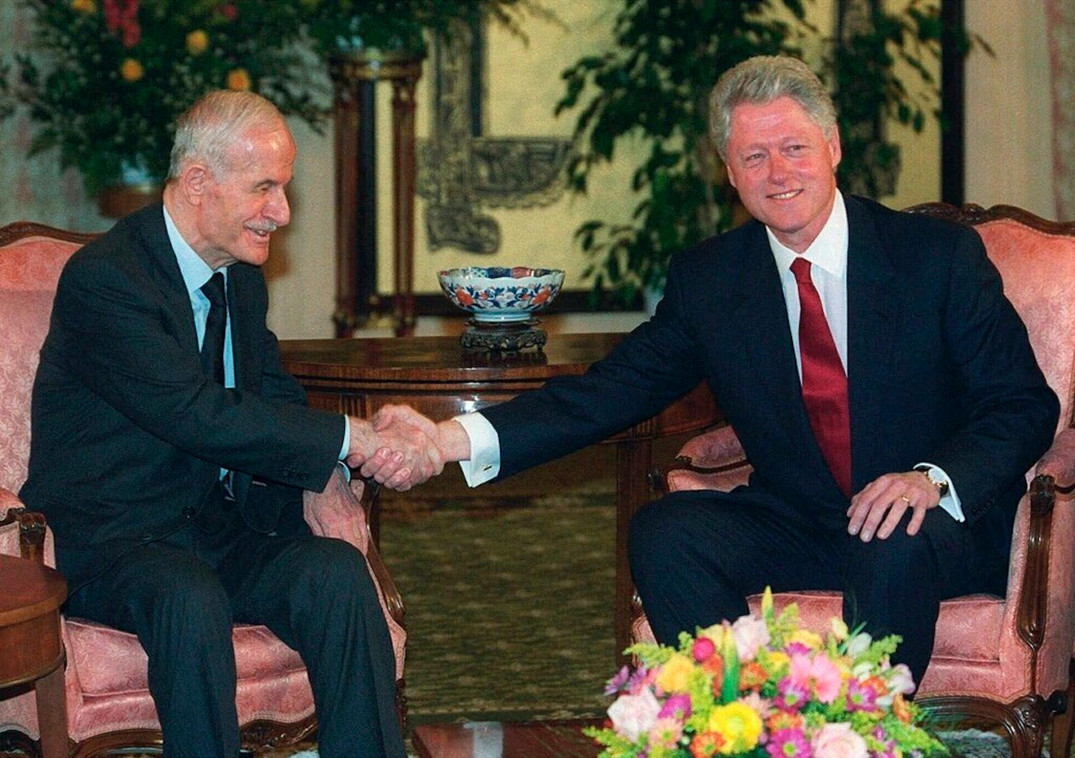 U.S. President Bill Clinton shook hands with Syrian President Hafez Assad at the opening of a March 2000 meeting, in Geneva, Switzerland.