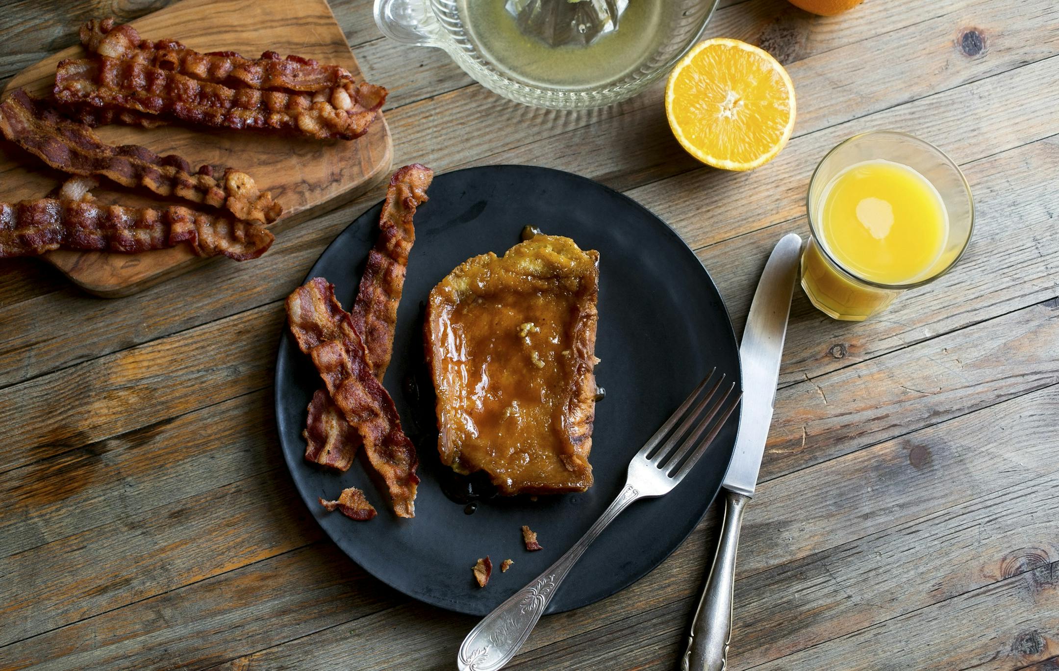 Creme brulee French toast, served with fresh orange juice and bacon.