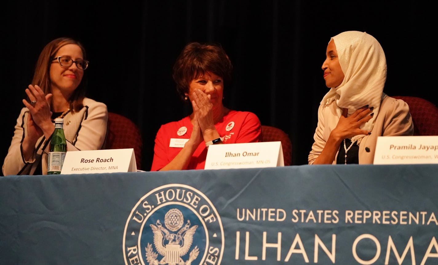 U.S. Rep. Ilhan Omar, right, held a Medicare for All town hall on Thursday night in Minneapolis. From left are State Sen. Melisa Franzen and with Rose Roach, executive director of Minnesota Nurses Association.