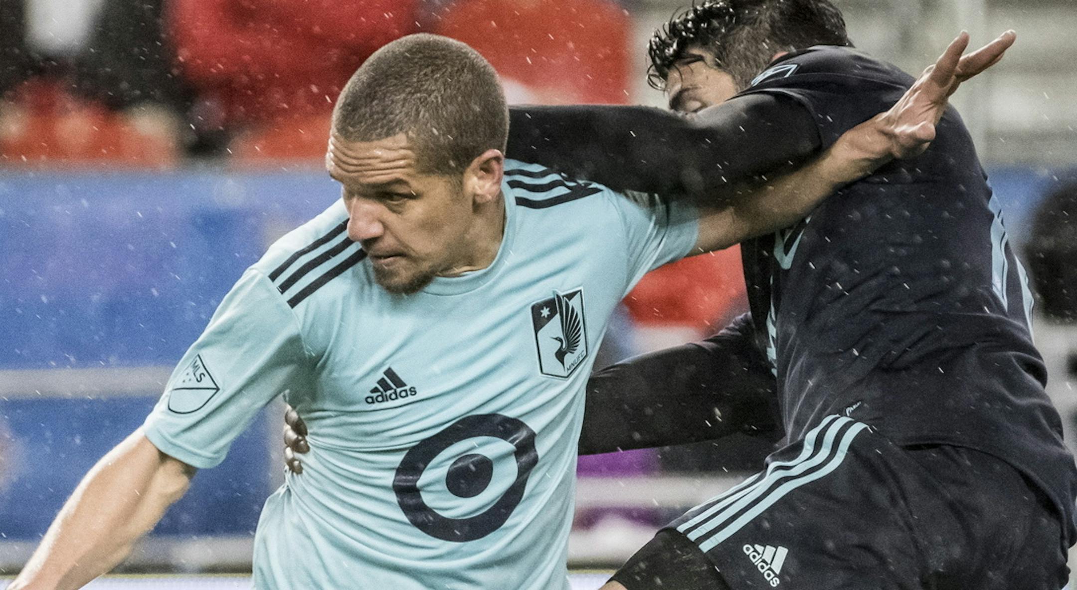 Minnesota United midfielder Osvaldo Alonso (6) defends against Toronto FC midfielder Alejandro Pozuelo (10) in second-half MLS soccer match action in Toronto, Friday, April 19, 2019. (Christopher Katsarov/The Canadian Press via AP)