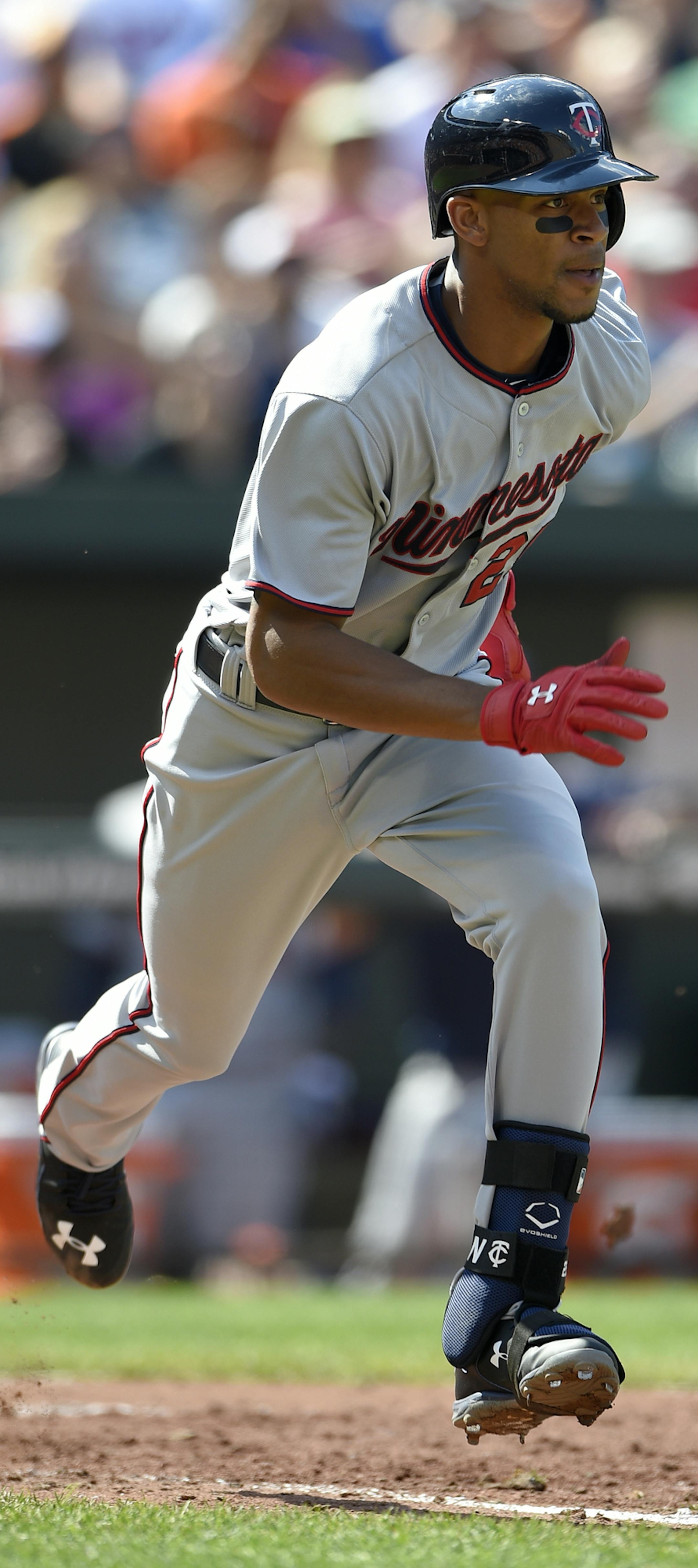 Minnesota Twins' Byron Buxton runs to first during a baseball game against the Baltimore Orioles, Sunday, Aug. 23, 2015, in Baltimore. The Twins won 4-3 in 12 innings. (AP Photo/Nick Wass)