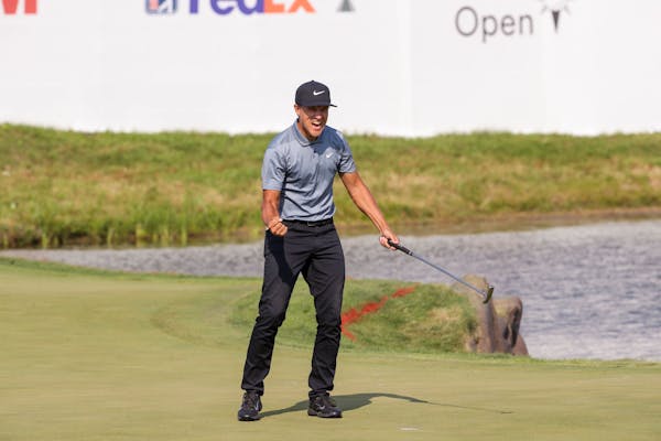 Cameron Champ celebrates after making his putt at the 18th hole to win the tournament at the 3M Open at TPC Twin Cities on Sunday, July 25, 2021 in Bl