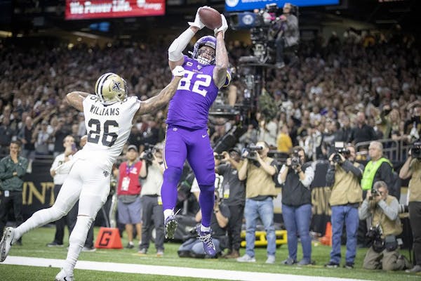 Minnesota Vikings tight end Kyle Rudolph catches the winning touchdown over New Orleans Saints cornerback P.J. Williams in overtime on Sunday, Jan. 5,