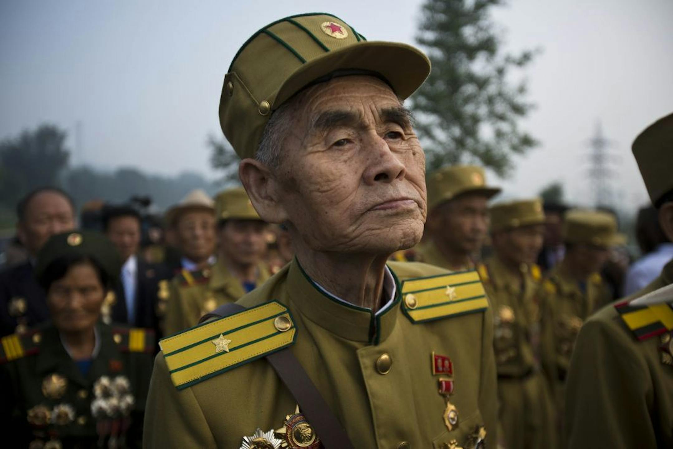North Korean veterans of the Korean War enter a cemetery for Korean War veterans on Thursday, July 25, 2013 in Pyongyang, North Korea during an opening ceremony marking the 60th anniversary of the signing of the armistice that ended hostilities on the Korean peninsula.