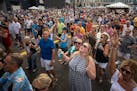 The crowd sings "Hey Jude" along with the Fabulous Armadillo's during their performance at the Taste of Minnesota in Minneapolis Sunday afternoon. Thi