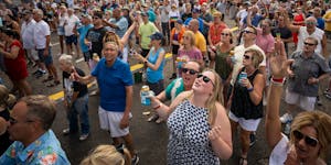 The crowd sings "Hey Jude" along with the Fabulous Armadillo's during their performance at the Taste of Minnesota in Minneapolis Sunday afternoon. Thi