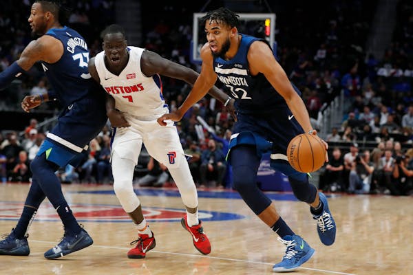 Timberwolves center Karl-Anthony Towns drove past Pistons forward Thon Maker during the second half Monday.