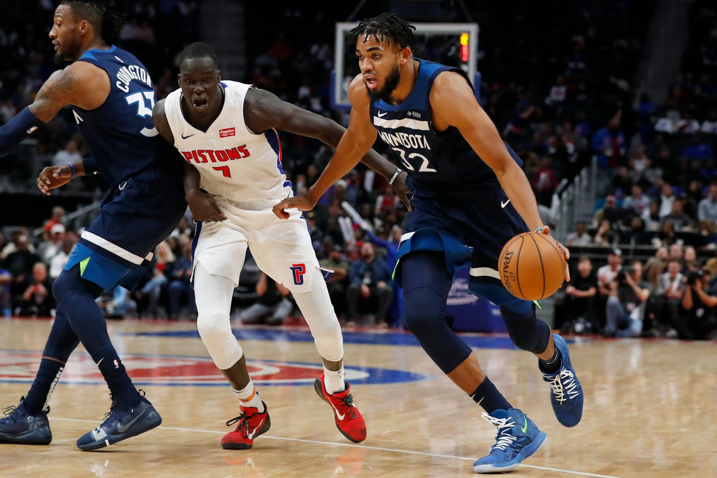 Timberwolves center Karl-Anthony Towns drove past Pistons forward Thon Maker during the second half Monday.