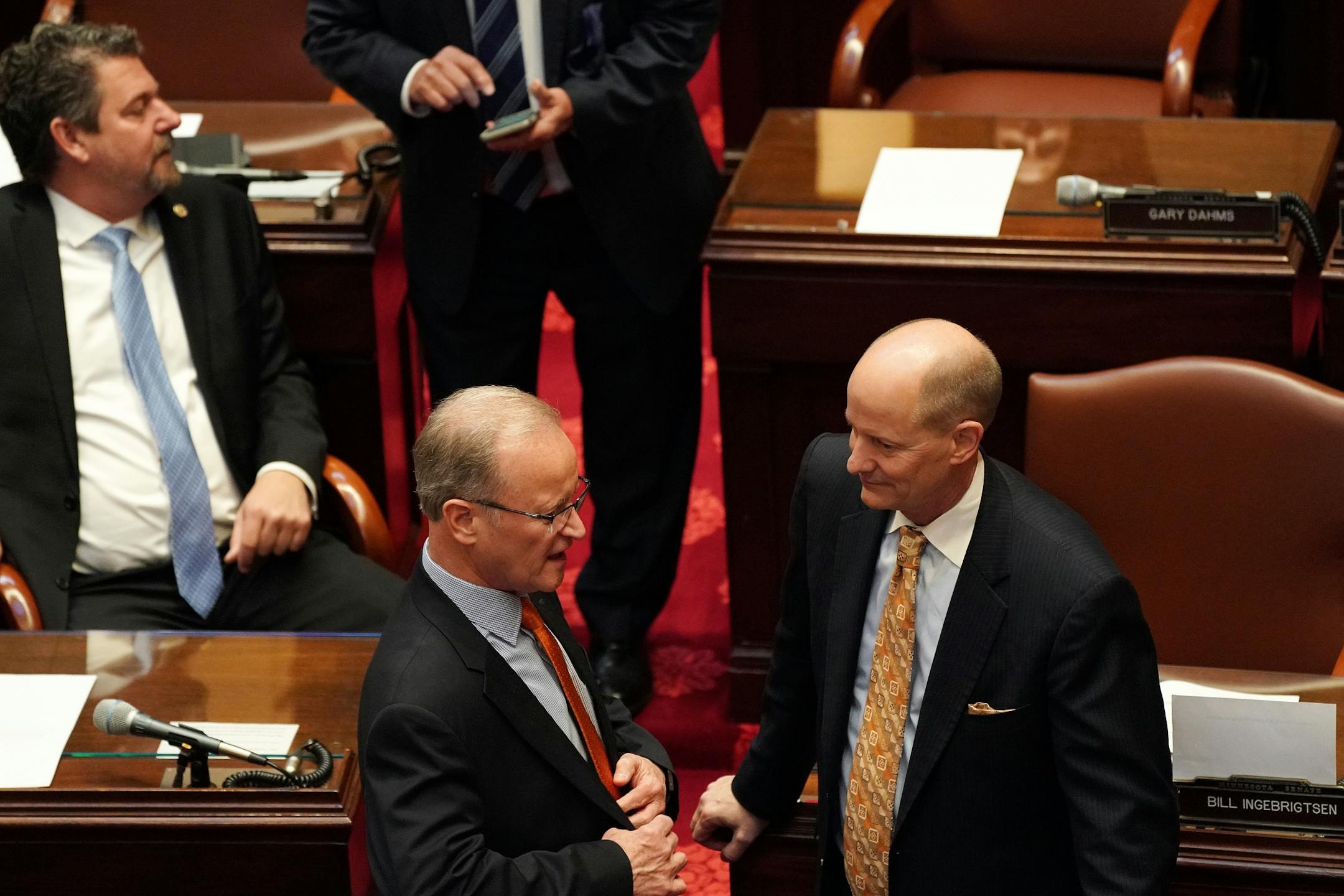 Senate republican majority leader Sen. Paul Gazelka (R-Nisswa), right, talked with colleagues in the Senate Chamber on the first day of the legislative session.